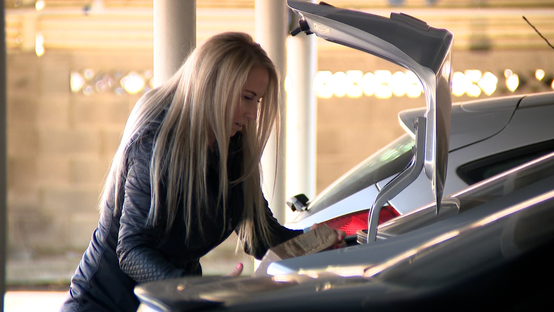Julie Barker helps her mom, Joanna Larsen, who spends year-round getting ready for Christmas by collecting hundreds of toys for less-fortunate children, in this undated photo.