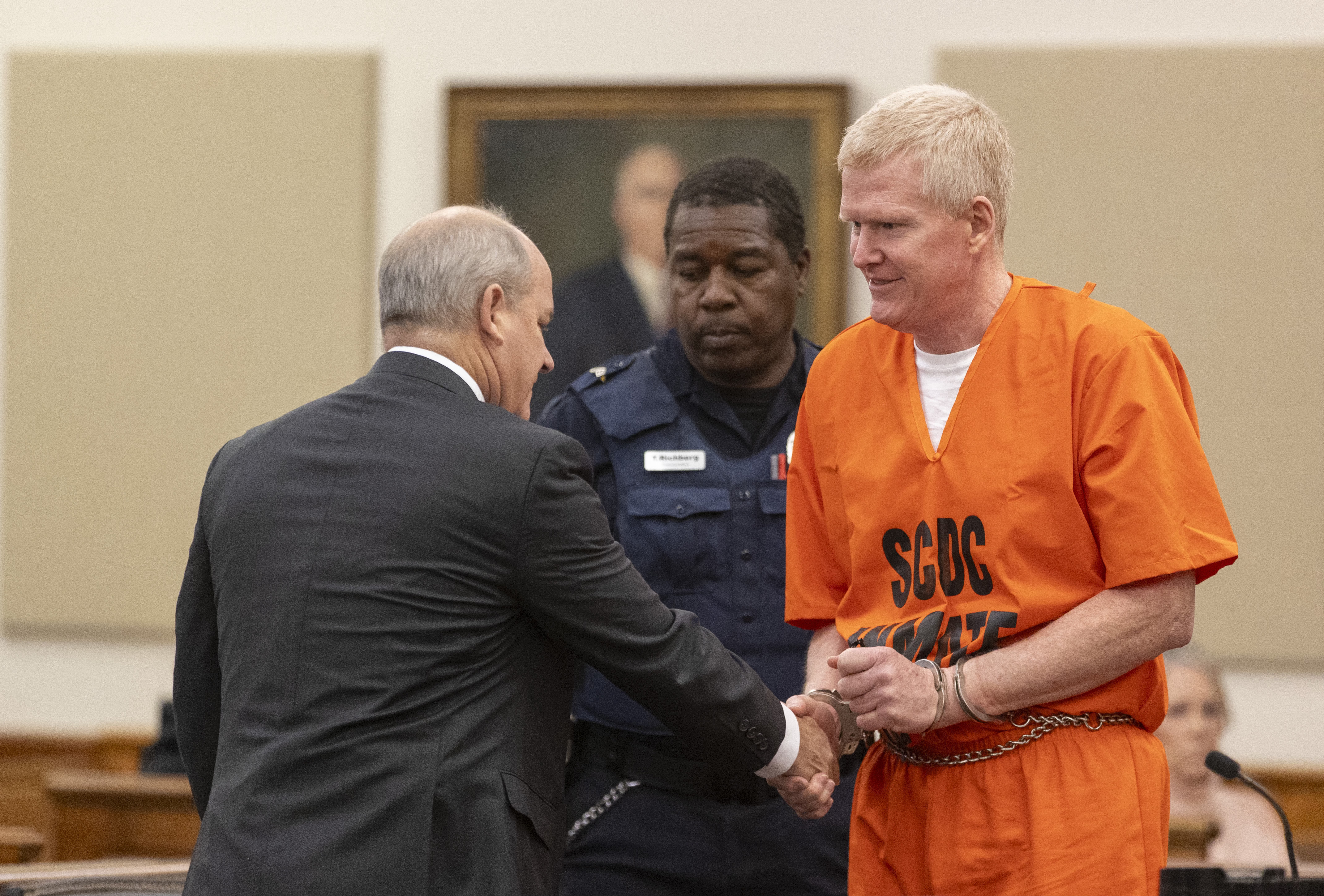 Alex Murdaugh shakes hands with his attorney Jim Griffin during his sentencing for stealing from 18 clients, Tuesday at the Beaufort County Courthouse in Beaufort, S.C.