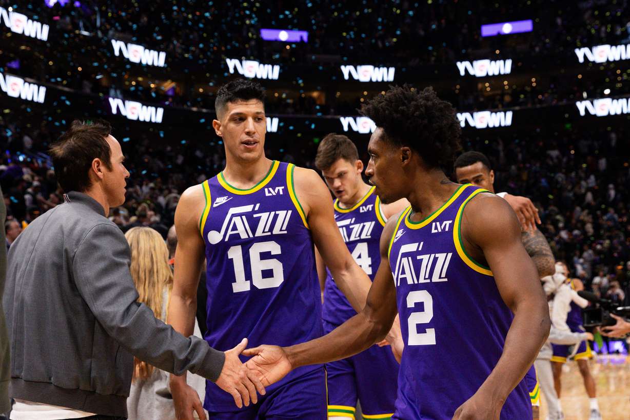 Utah Jazz teammates Simone Fontecchio (16) and Collin Sexton (2) walk off the court after their 114-112 win over the New Orleans Pelicans at the Delta Center in Salt Lake City on Monday, Nov. 27, 2023.