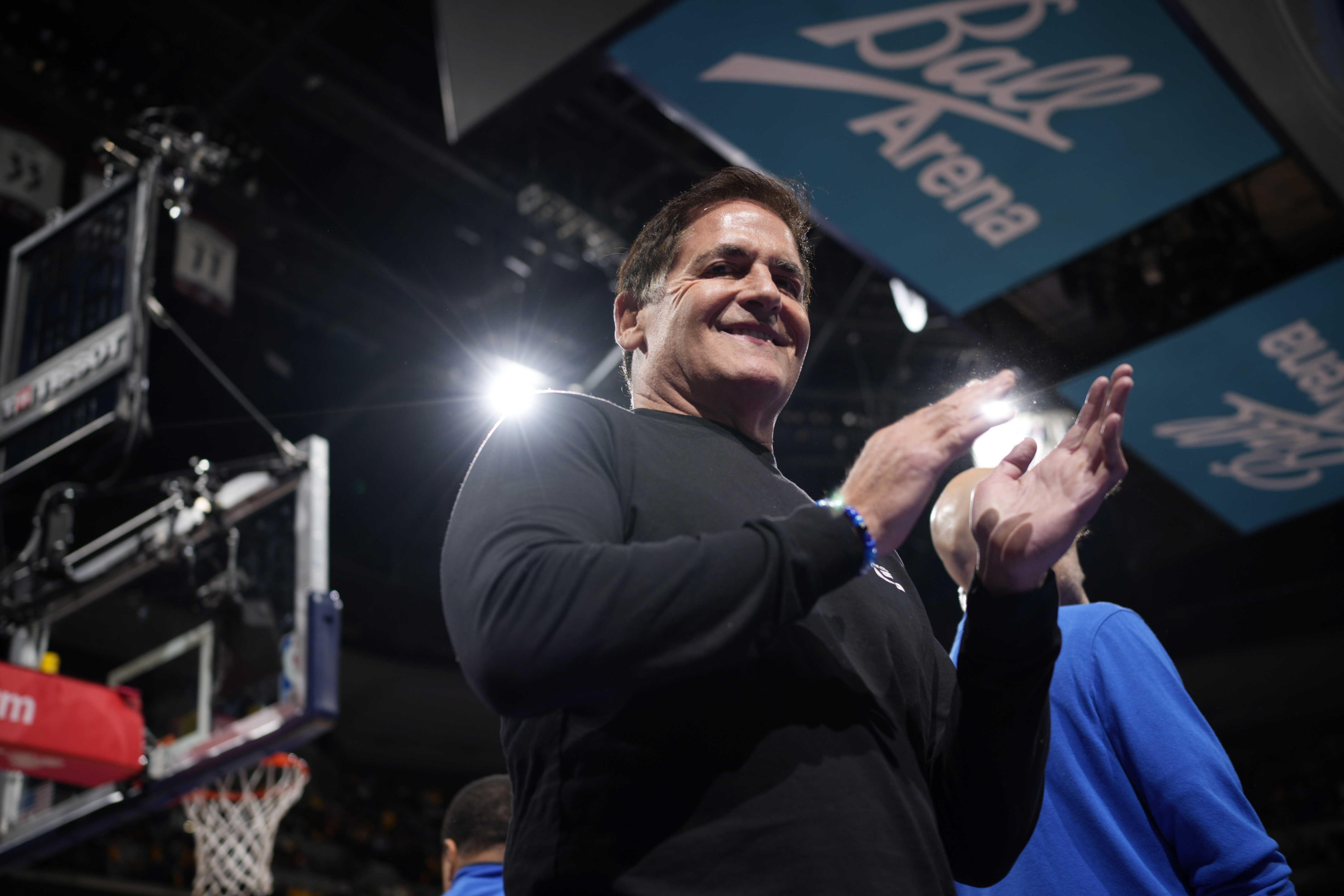 Dallas Mavericks owner Mark Cuban applauds as Mavericks are introduced for an NBA basketball in-season tournament game against the Denver Nuggets on Friday, Nov. 3, 2023, in Denver.