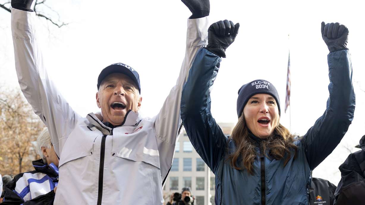 Fraser Bullock, president and CEO of the Salt Lake City-Utah Committee for the Games, and Salt Lake City Mayor Erin Mendenhall cheer as Salt Lake City is named as the preferred host for 2034 Olympics on Wednesday.