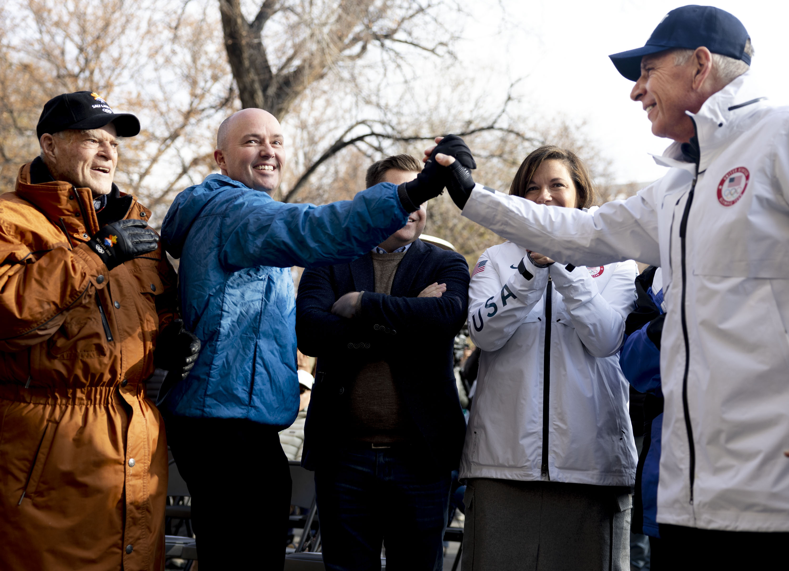 Spence Eccles, Gov. Spencer Cox and Fraser Bullock, president and CEO of the Salt Lake City-Utah Committee for the Games, cheer as Salt Lake City is named as the preferred host for 2034 Olympics during a “watch party” at the Salt Lake City and County Building in Salt Lake City on Wednesday.