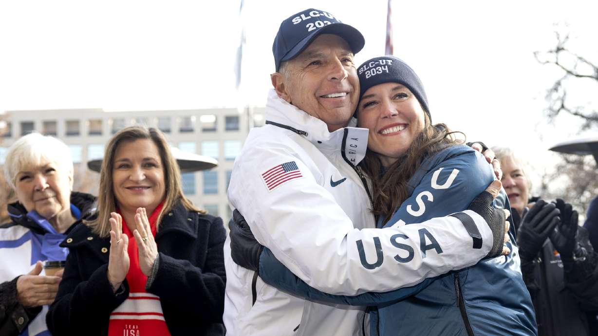 Gail Miller, left, Salt Lake County Mayor Jenny Wilson, Fraser Bullock, and Salt Lake City Mayor Erin Mendenhall cheer as Salt Lake City is named as the preferred host for 2034 Olympics at the Salt Lake City-County Building on Wednesday.