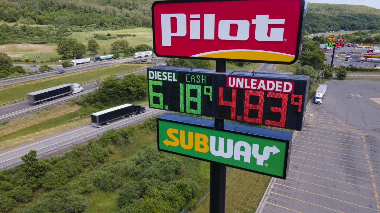 A Pilot Travel Center sign displaying fuel prices in Bath, New York, on Monday, June 20, 2022. Warren Buffett’s Berkshire Hathaway says the billionaire Haslam family tried to bribe at least 15 executives at the Pilot truck stop chain.