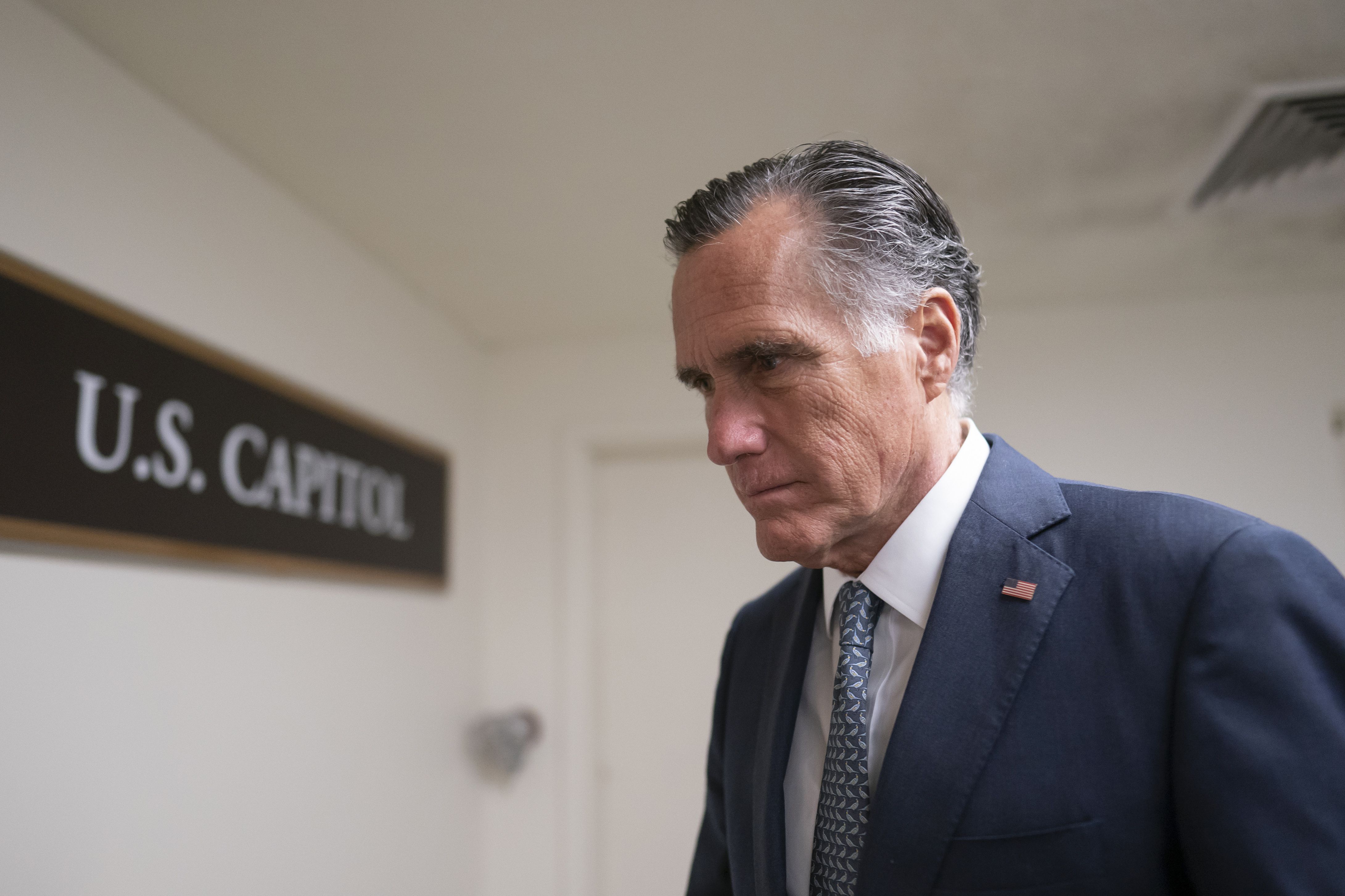 Sen. Mitt Romney, R-Utah, walks inside the Capitol in Washington on March 16, 2022. Romney insisted on solving the climbing U.S. national debt urgently and backed his proposal of creating a commission to tackle this problem.
