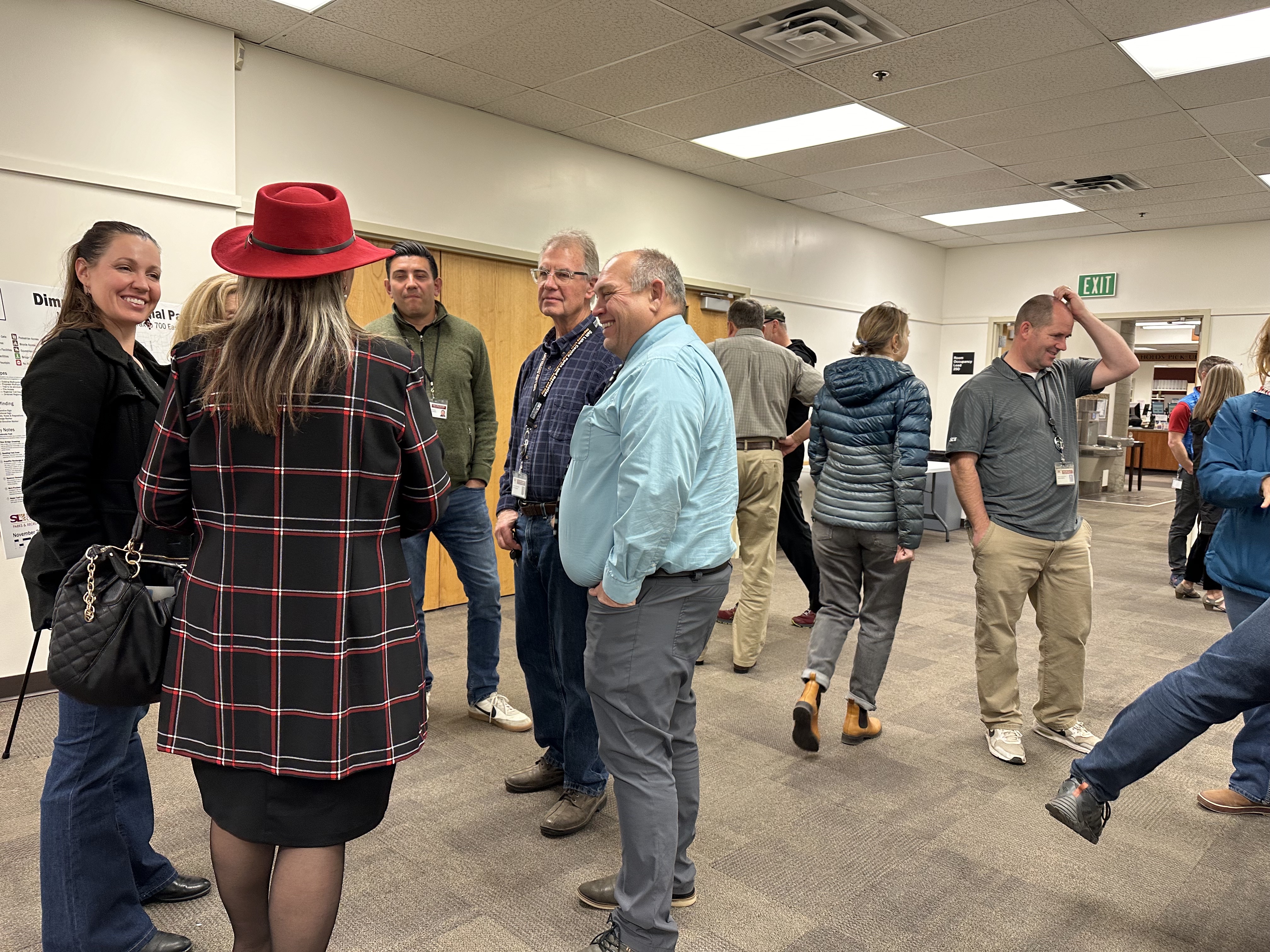 Mayor Monica Zoltanski speaks with park officials during a public open house Wednesday at the Sandy library about proposed plans for the future of Dimple Dell Regional Park.