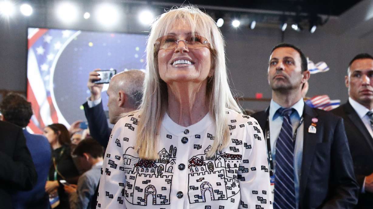 FILE - Miriam Adelson, wife of Las Vegas Sands Corporation Chief Executive and Republican mega donor Sheldon Adelson, listens as President Donald Trump speaks at the Israeli American Council National Summit in Hollywood, Fla., Saturday, Dec. 7, 2019. Miriam Adelson, the controlling shareholder of casino company Las Vegas Sands Corp., plans to sell $2 billion in company stock and buy an unspecified professional sports franchise, the company announced Tuesday, Nov. 28, 2023. Dallas Mavericks owner Mark Cuban is working on a deal to sell a majority stake in the NBA franchise to the Adelson family, a person with knowledge of the talks said late Tuesday.