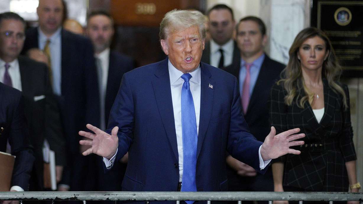 Former President Donald Trump speaks outside the courtroom after testifying at New York Supreme Court, Nov. 6, in New York. A New York appeals court has reinstated a gag order that barred Donald Trump from commenting about court personnel.
