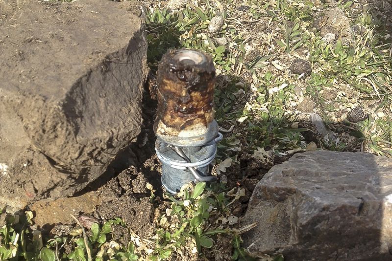 This March 16, 2017, photo shows a cyanide device in Pocatello, Idaho. Citing public safety concerns, the Bureau of Land Management is ending the use of spring-loaded booby traps planted on public lands that eject cyanide powder when triggered to kill coyotes and other livestock predators, a practice wildlife advocates and others have been trying to outlaw for decades.
