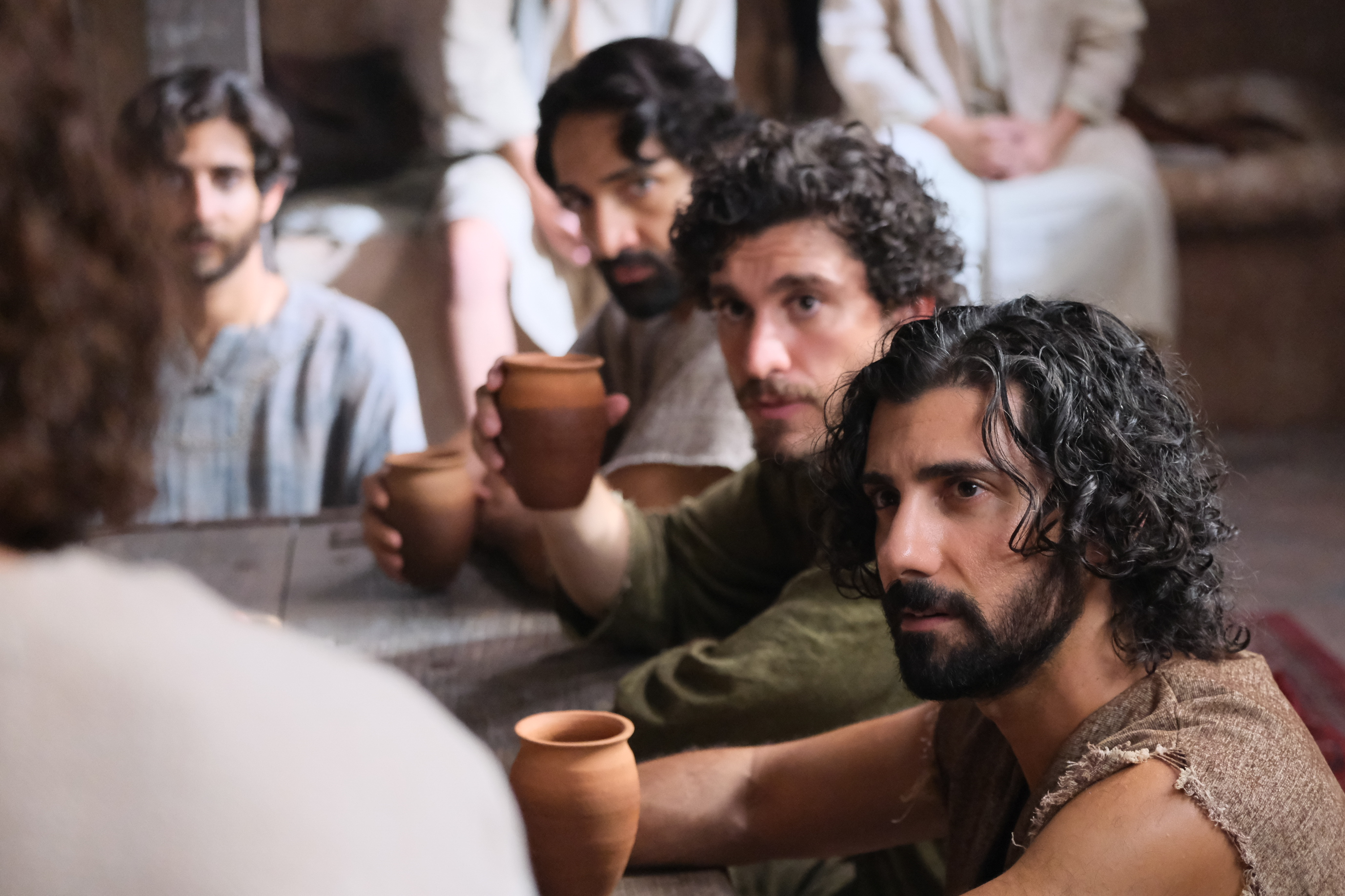 Judas, Big James, John, Andrew listen to Jesus in a scene from “The Chosen.”