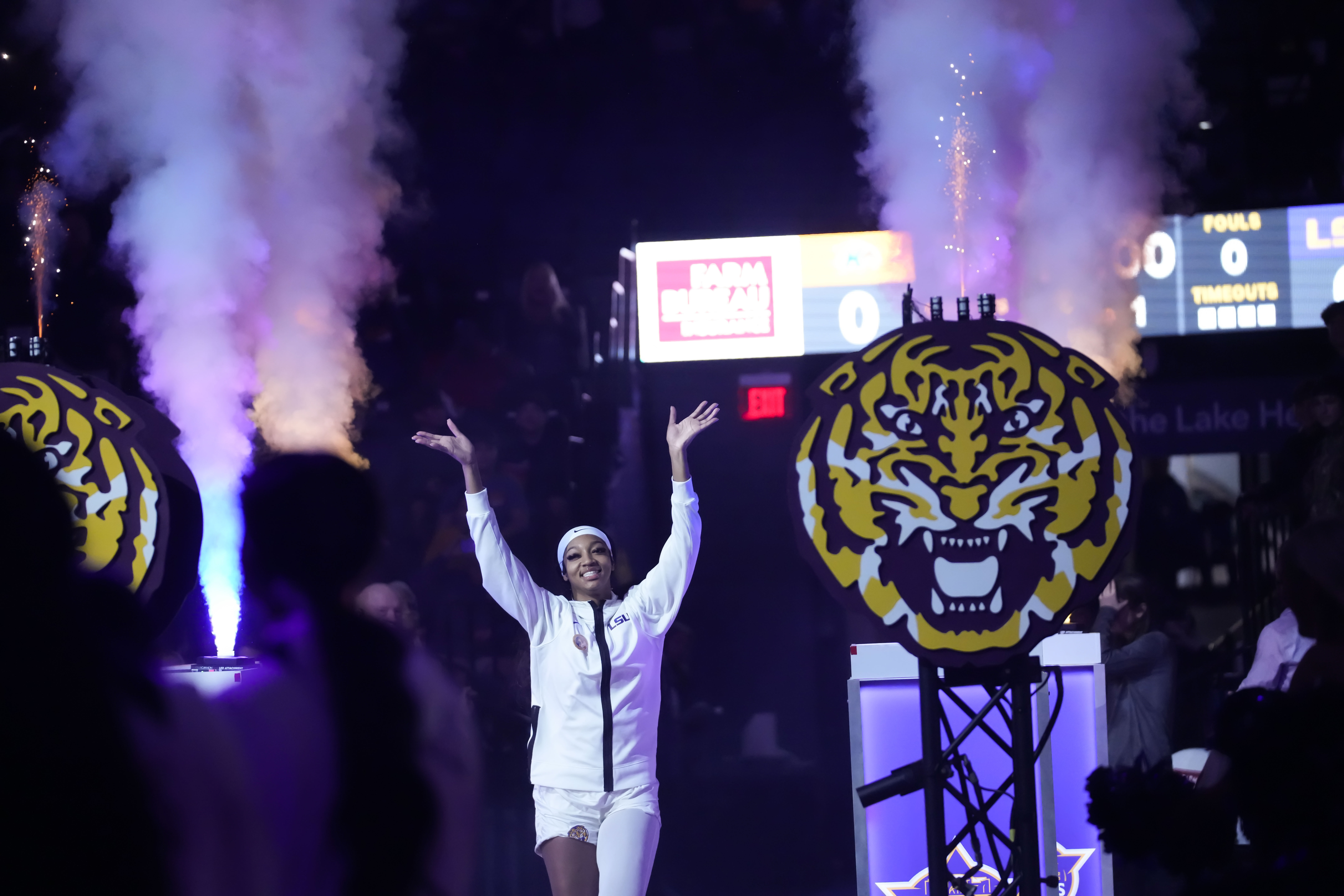 LSU forward Angel Reese waves to the crowd as she is introduced before an NCAA college basketball game against Kent State in Baton Rouge, La., Tuesday, Nov. 14, 2023.