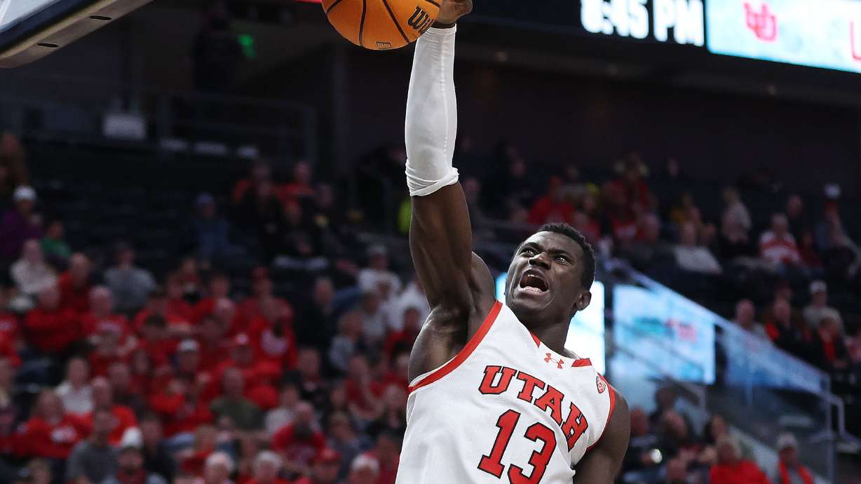 Utah Utes center Keba Keita (13) dunks at the Delta Center in Salt Lake City on Thursday, Nov. 30, 2023. Utah won 79-66.