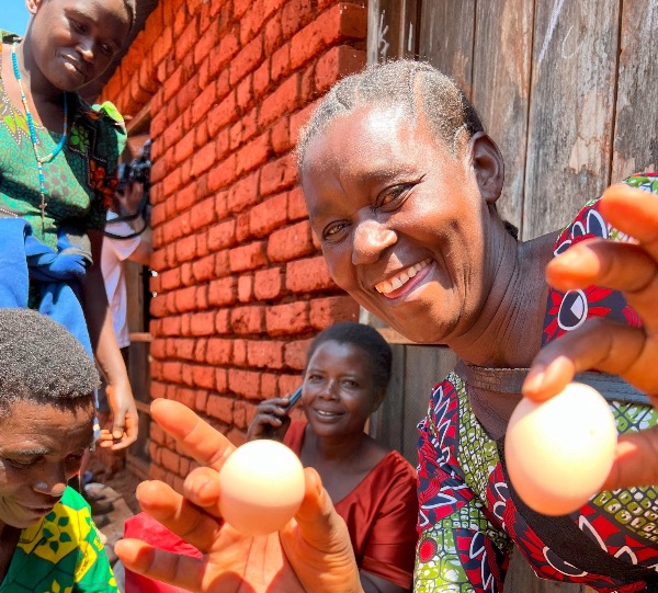 Leokadia Gude is one of 30 women who created a chicken-and-eggs business in Muganaza, Tanzania, funded by the Light the World Giving Machines through Church World Service. They have turned 270 donated chicks into more than 7,000 chickens.