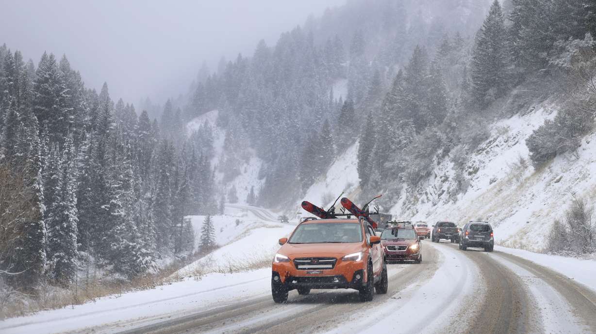 Motorists drive in Big Cottonwood Canyon on Friday. Up to 2 feet of snow or more is expected across some of Utah's mountains this weekend, while a few inches are possible in some valley communities.