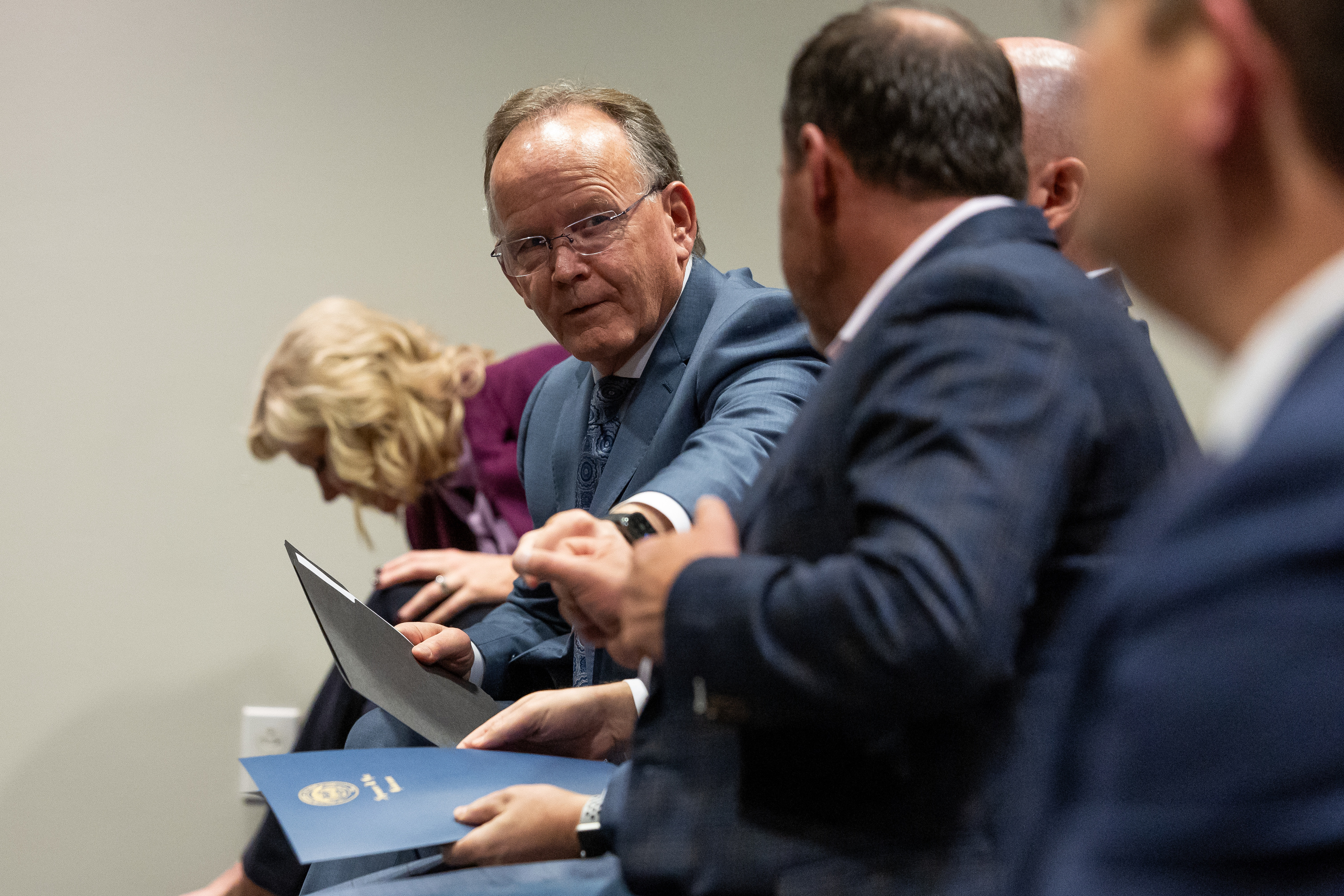 Senate President Stuart Adams, R-Layton, first-bumps House Speaker Mike Schultz, R-Hooper, during a press conference about campus free speech at the Utah System of Higher Education office in Salt Lake City on Friday.
