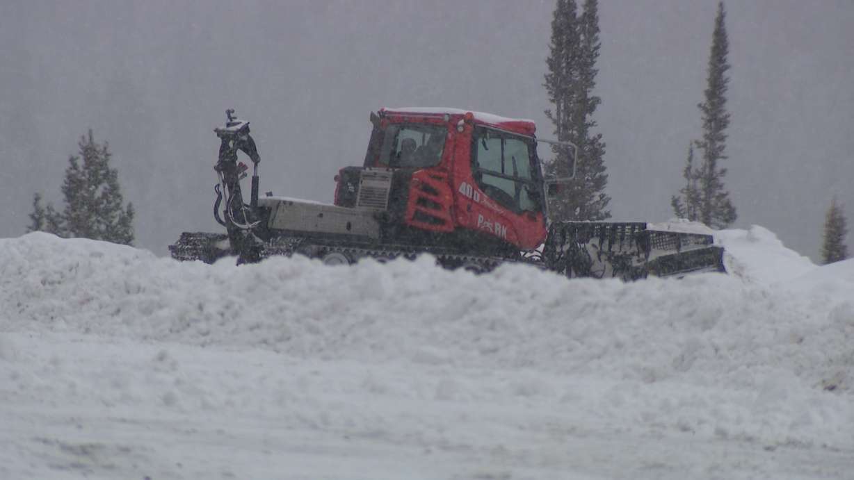 Workers at Beaver Mountain are already grooming snow while some skiers and snowboarders get a head start on Friday.