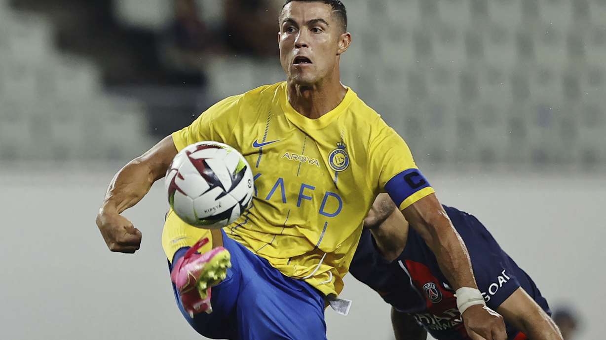 FILE - Al Nassr's Cristiano Ronaldo controls the ball during a friendly soccer match against Paris Saint-Germain in Osaka, western Japan, on July 25, 2023. Ronaldo walked off the field with the gleeful chants of “Messi! Messi!” ringing in his ears from delighted Al-Hilal fans who had just watched their Saudi Pro League team beat the Portugal superstar's Al-Nassr 3-0 in the Riyadh Derby on Friday.