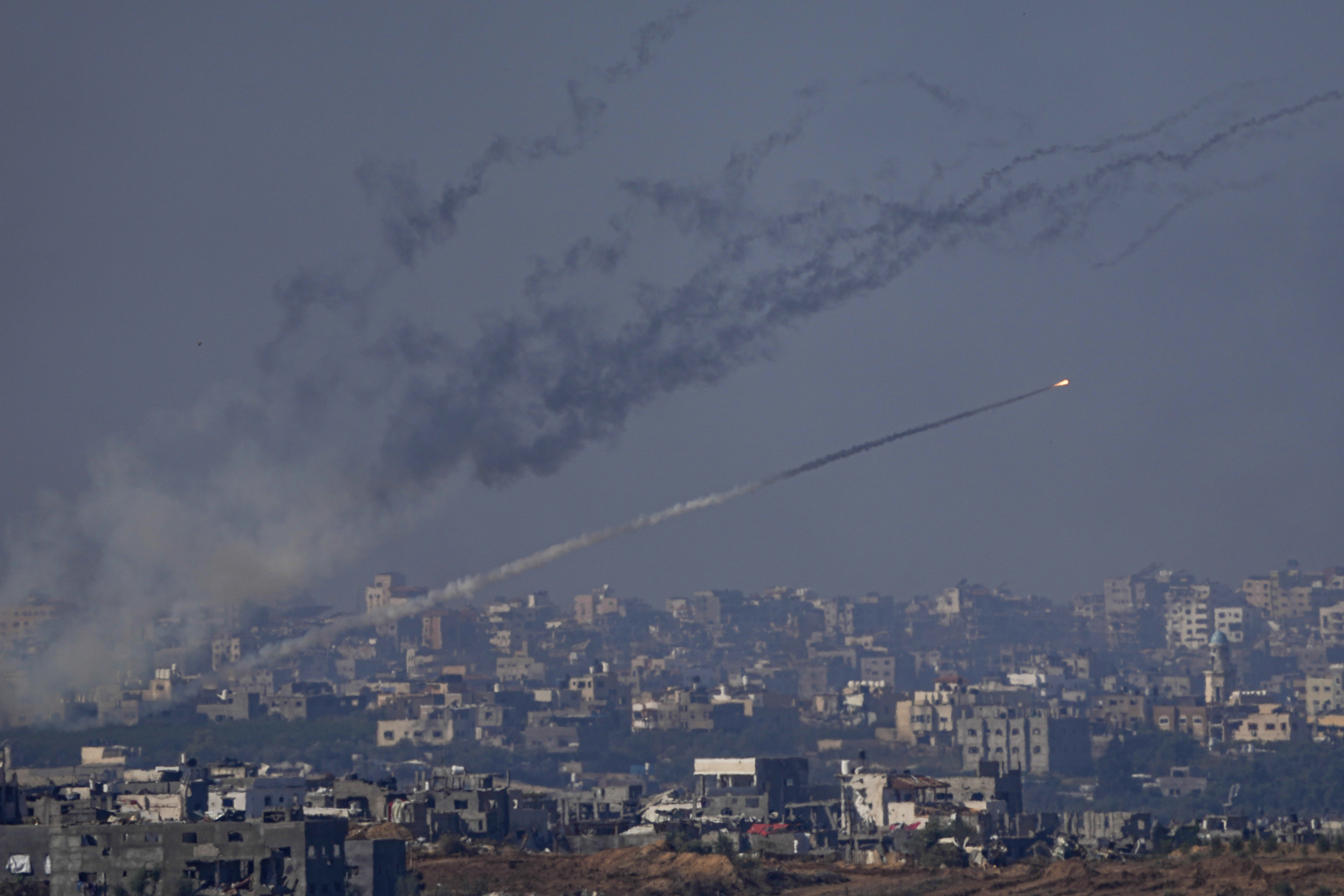 Rockets are fired toward Israel from the Gaza Strip, as seen from southern Israel, Friday. Israel is pounding targets in southern Gaza and ordering more neighborhoods to evacuate, even as the United States urges it to do more to protect civilians.