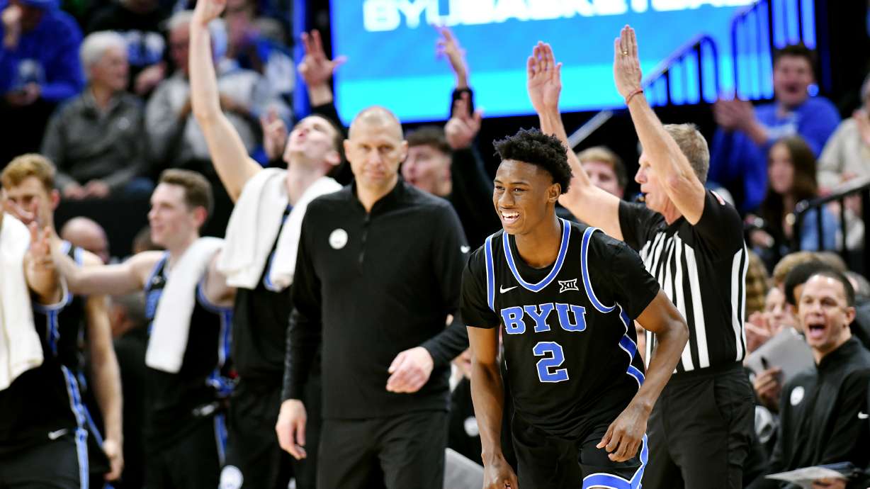 BYU Cougars guard Jaxson Robinson (2) smiles after dropping in a 3-point shot as BYU and Fresno State play at the Delta Center in Salt Lake City on Friday, Dec. 1, 2023. BYU won 85-56.