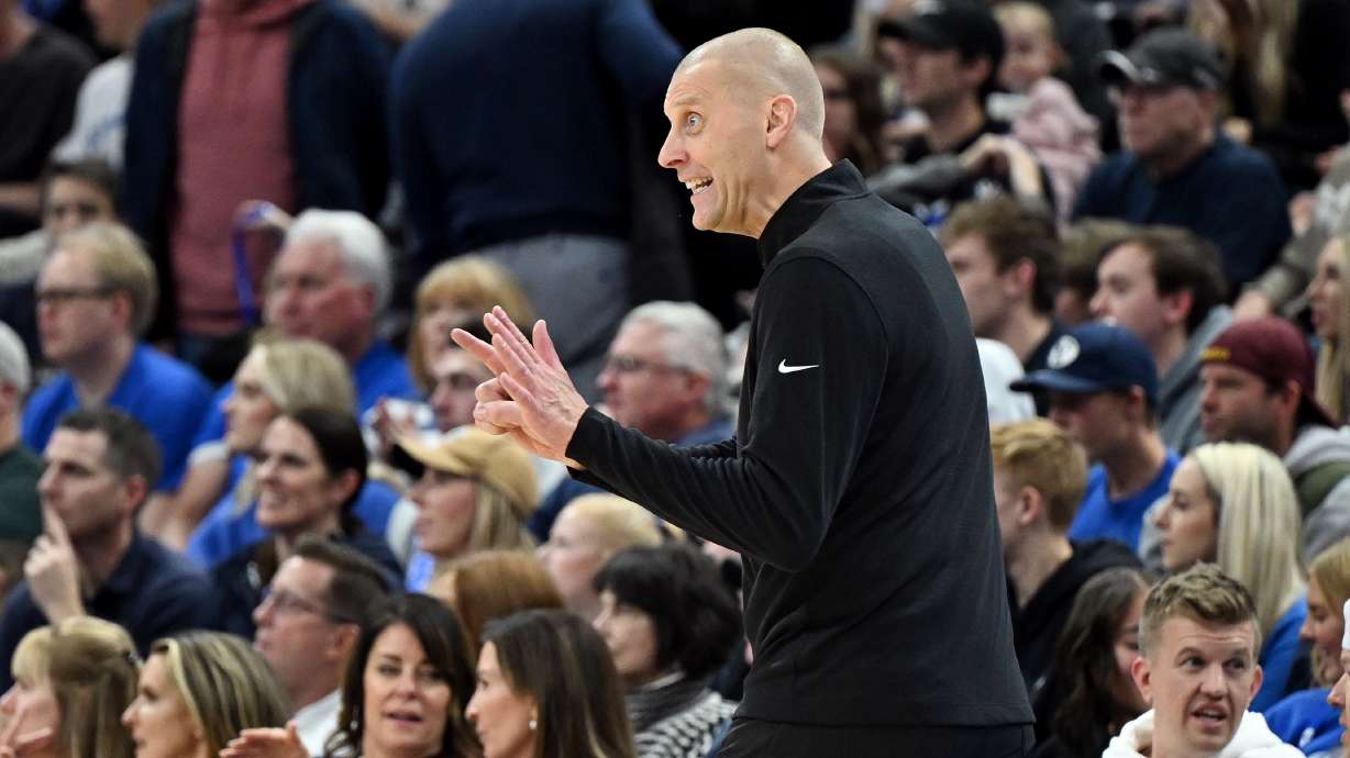 BYU Cougars head coach Mark Pope motions a play to his players as BYU and Fresno State play at the Delta Center in Salt Lake City on Friday, Dec. 1, 2023. BYU won 85-56.