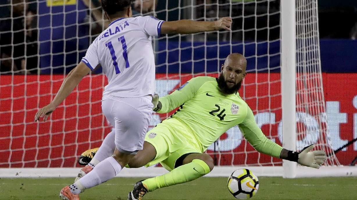 FILE - United States' goalie Tim Howard (24) blocks a shot by El Salvador's Rodolfo Zelaya (11) during a CONCACAF Gold Cup quarterfinal soccer match in Philadelphia, July 19, 2017. Howard was elected to the U.S. National Soccer Hall of Fame on Saturday, Dec. 2, 2023, and will be inducted on May 4, 2024.