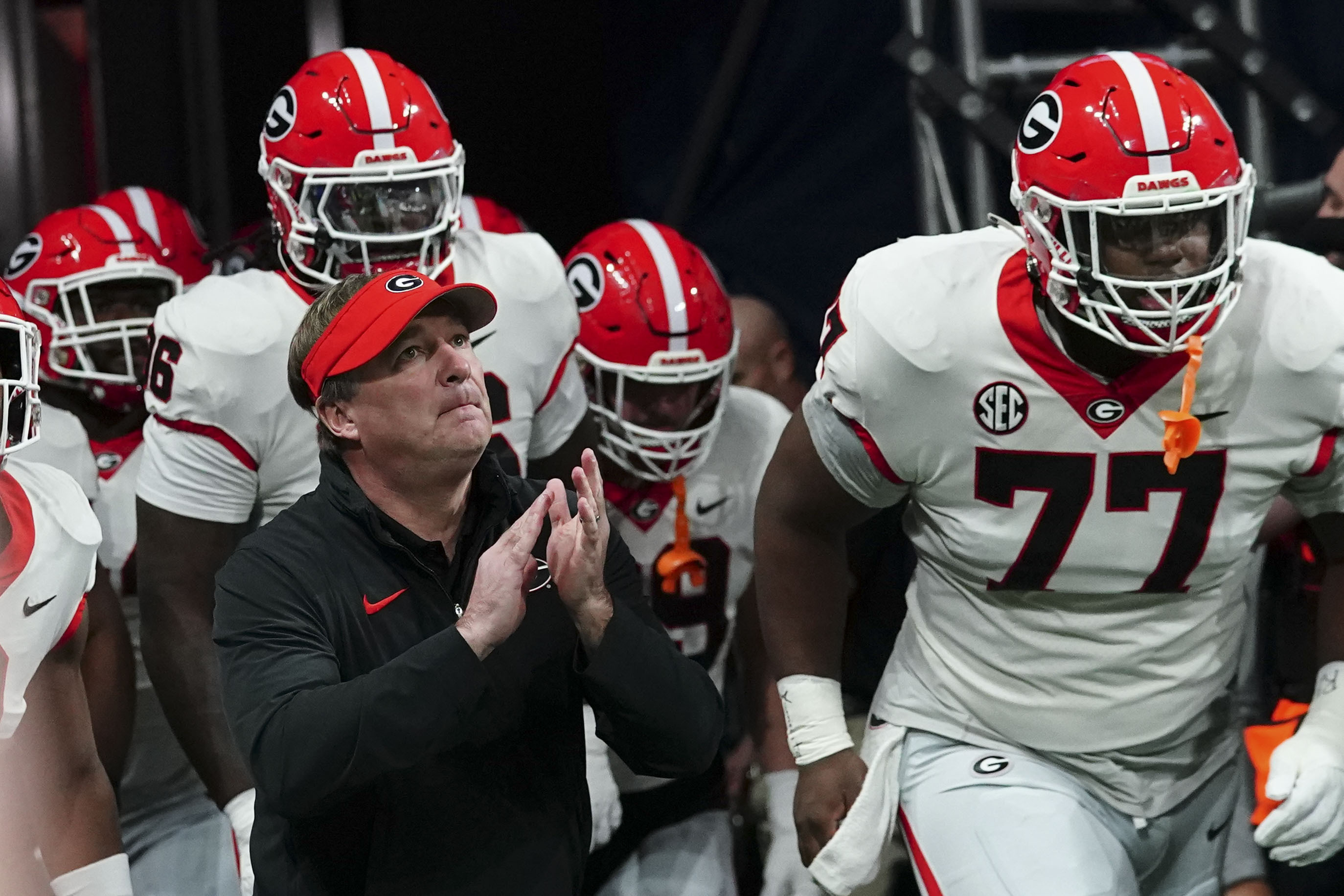 Georgia head coach Kirby Smart walk onto the field before the Southeastern Conference championship NCAA college football game in Atlanta, Saturday, Dec. 2, 2023.