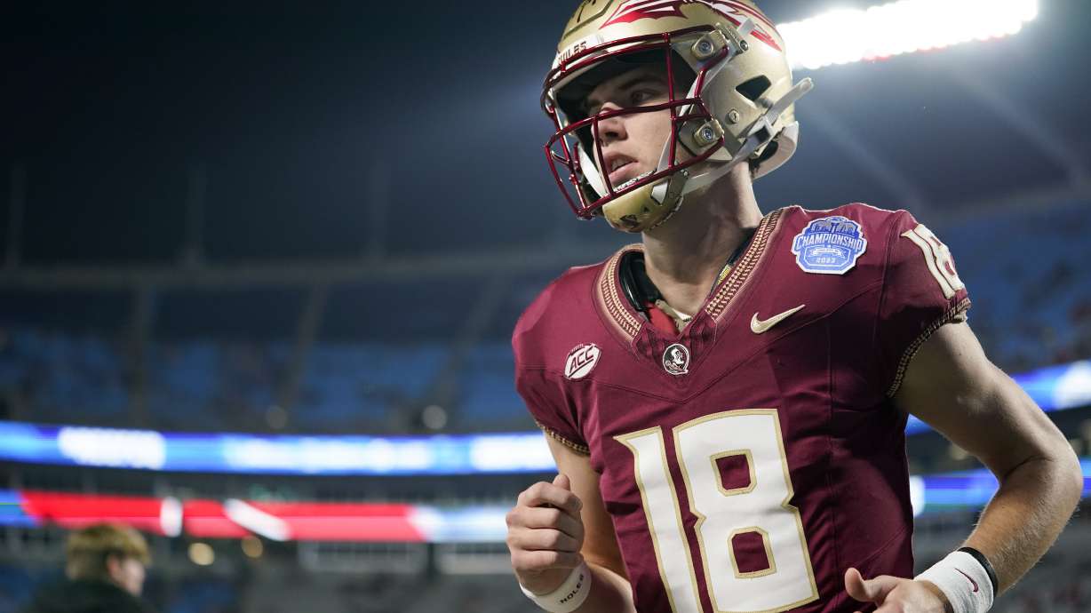 Florida State quarterback Tate Rodemaker runs to the field before the team's Atlantic Coast Conference Championship NCAA college football game against Louisville, Saturday, Dec. 2, 2023, in Charlotte, N.C.