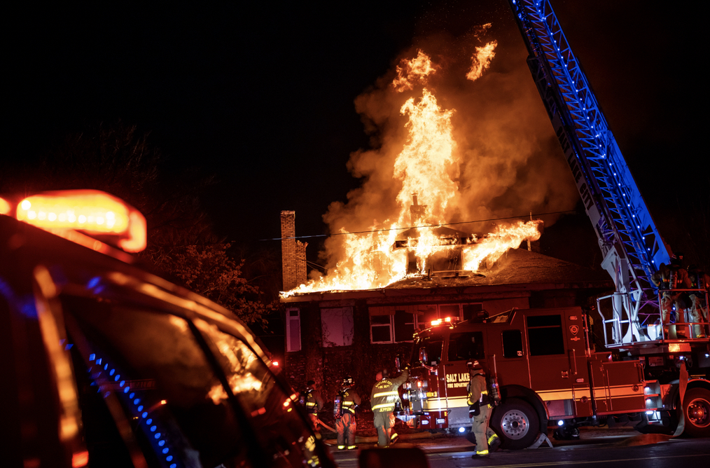 Firefighters work to put out a fire in Salt Lake City on Saturday.