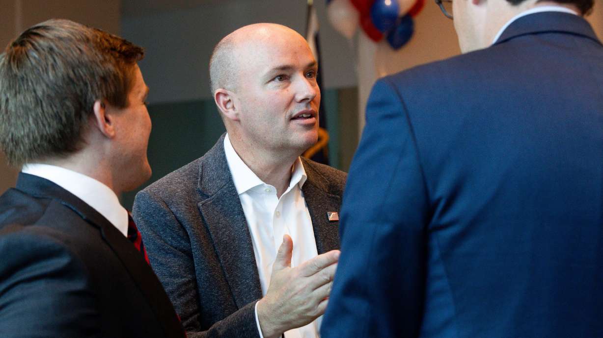 Rep. Tyler Clancy, R-Provo, left, and Utah Gov. Spencer Cox greet attendees at the Pathways to Purpose conference at the Provo Recreation Center in Provo on Saturday.