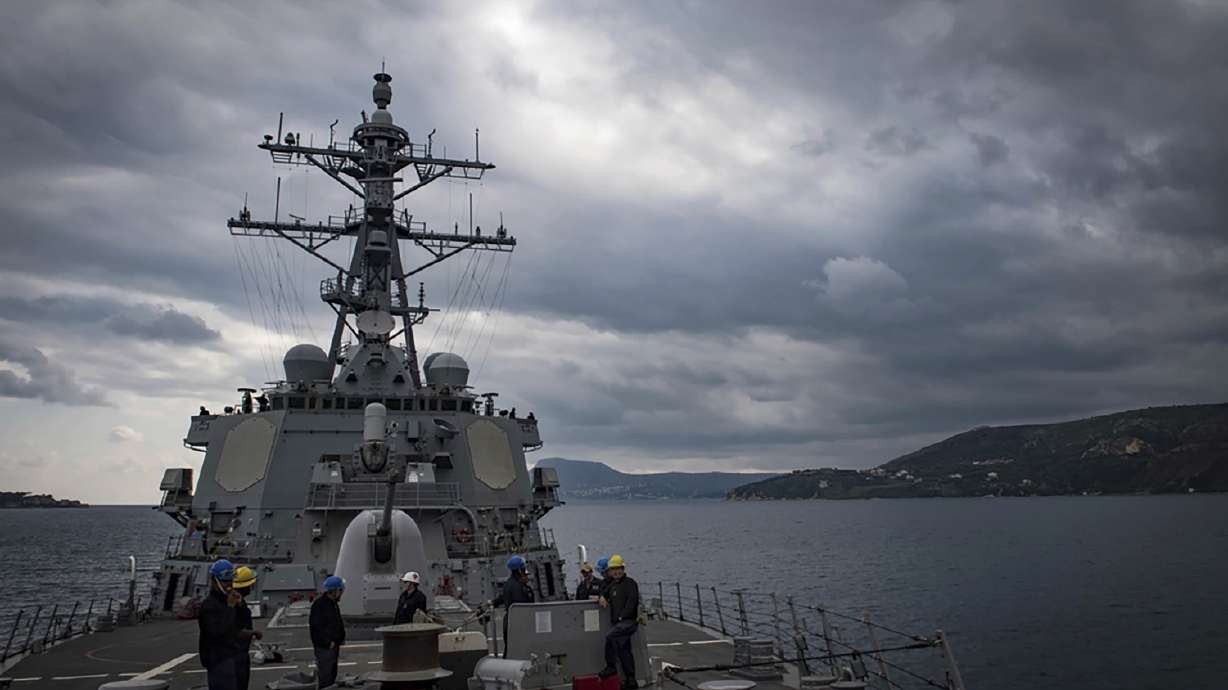The USS Carney warship and multiple commercial ships came under attack Sunday in the Red Sea, the Pentagon said, potentially marking a major escalation in a series of maritime attacks in the Mideast linked to the Israel-Hamas war.