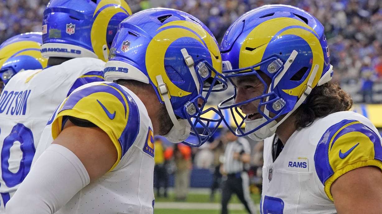 Los Angeles Rams wide receiver Puka Nacua, right, celebrates with quarterback Matthew Stafford (9) after catching a touchdown during the first half of an NFL football game Sunday, Dec. 3, 2023, in Inglewood, Calif.
