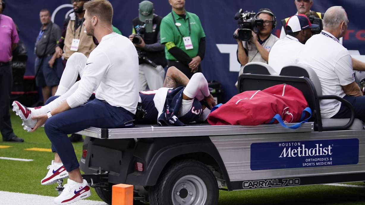 Houston Texans wide receiver Tank Dell is taken off the field after being injured in the first half of an NFL football game against the Denver Broncos Sunday, Dec. 3, 2023, in Houston.