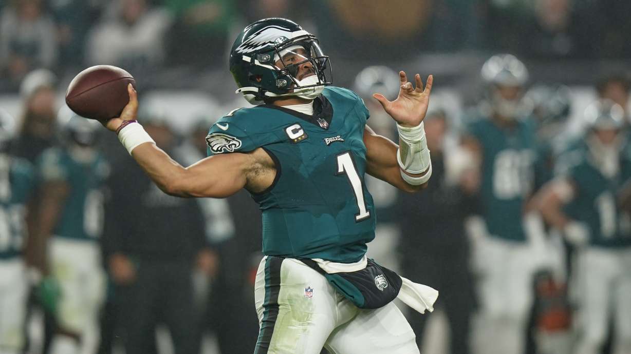 Philadelphia Eagles quarterback Jalen Hurts throws a pass against the San Francisco 49ers during the first half of an NFL football game, Sunday, Dec. 3, 2023, in Philadelphia.