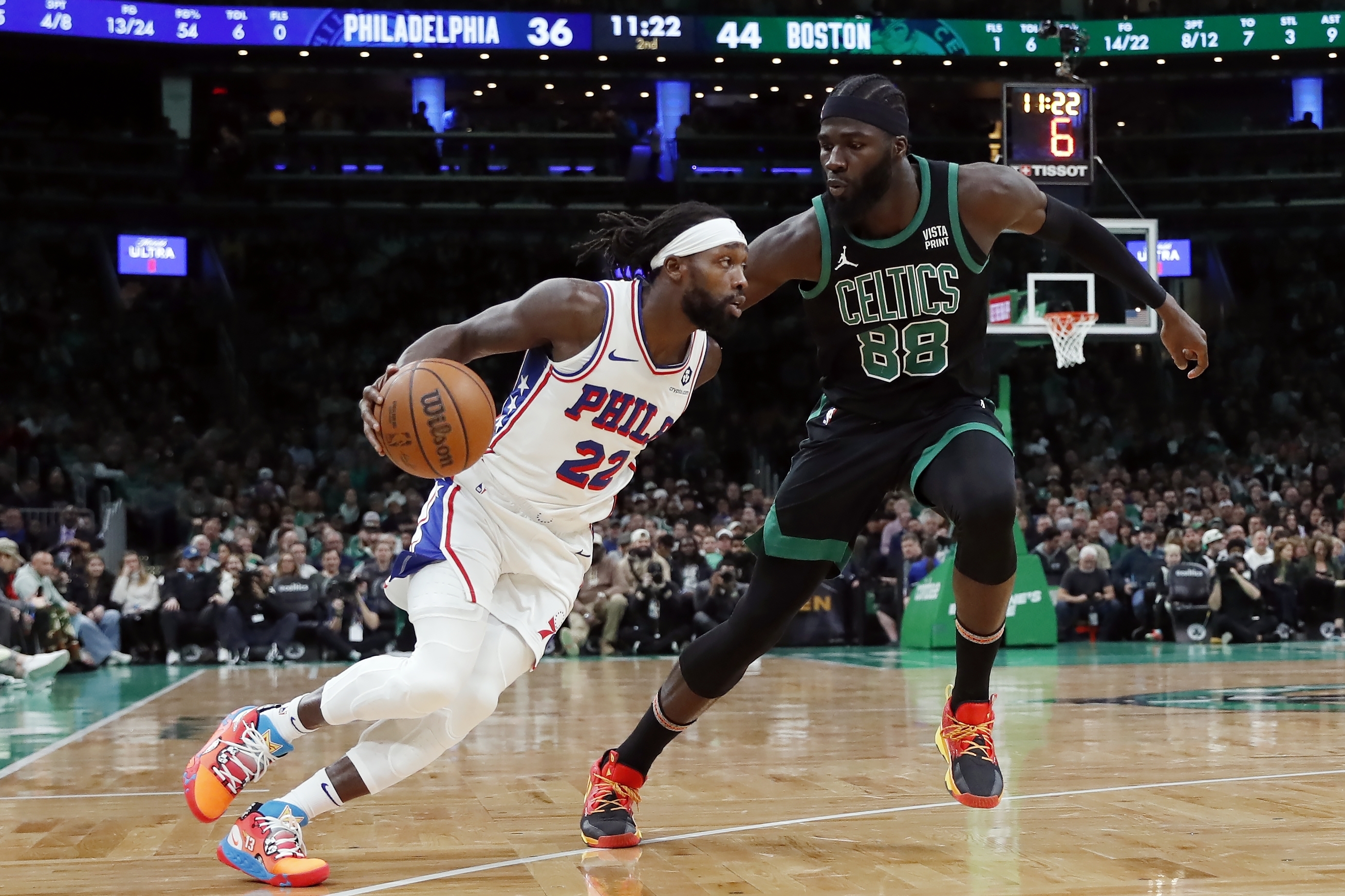 Philadelphia 76ers' Patrick Beverley (22) drives past Boston Celtics' Neemias Queta (88) during the first half of an NBA basketball game Friday, Dec. 1, 2023, in Boston.