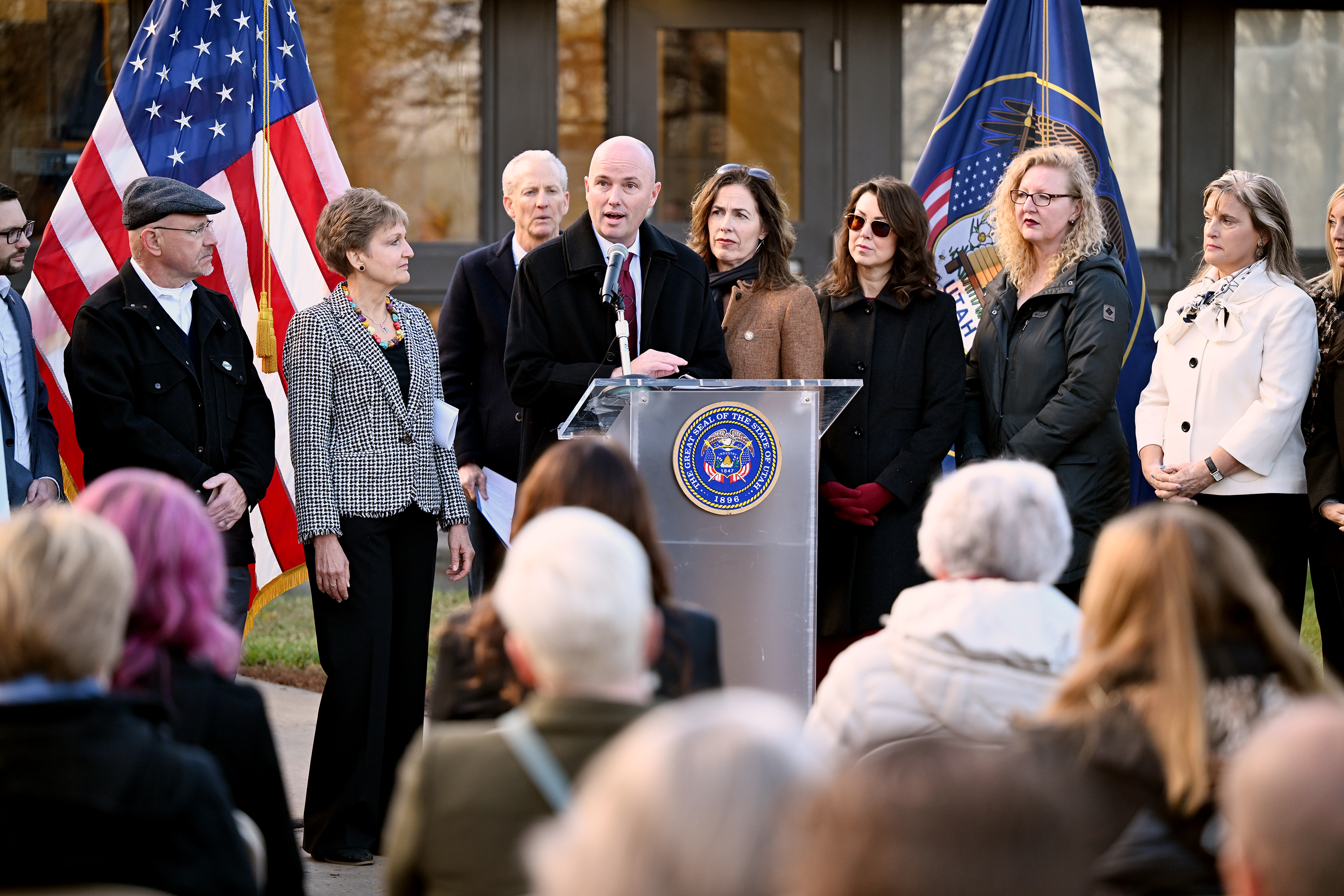 Gov. Spencer Cox is joined by local leaders and Lt. Gov. Deidre Henderson as he unveils the state's 2025 homelessness plan at a press conference at Atherton Community Treatment Center in West Valley City on Monday.