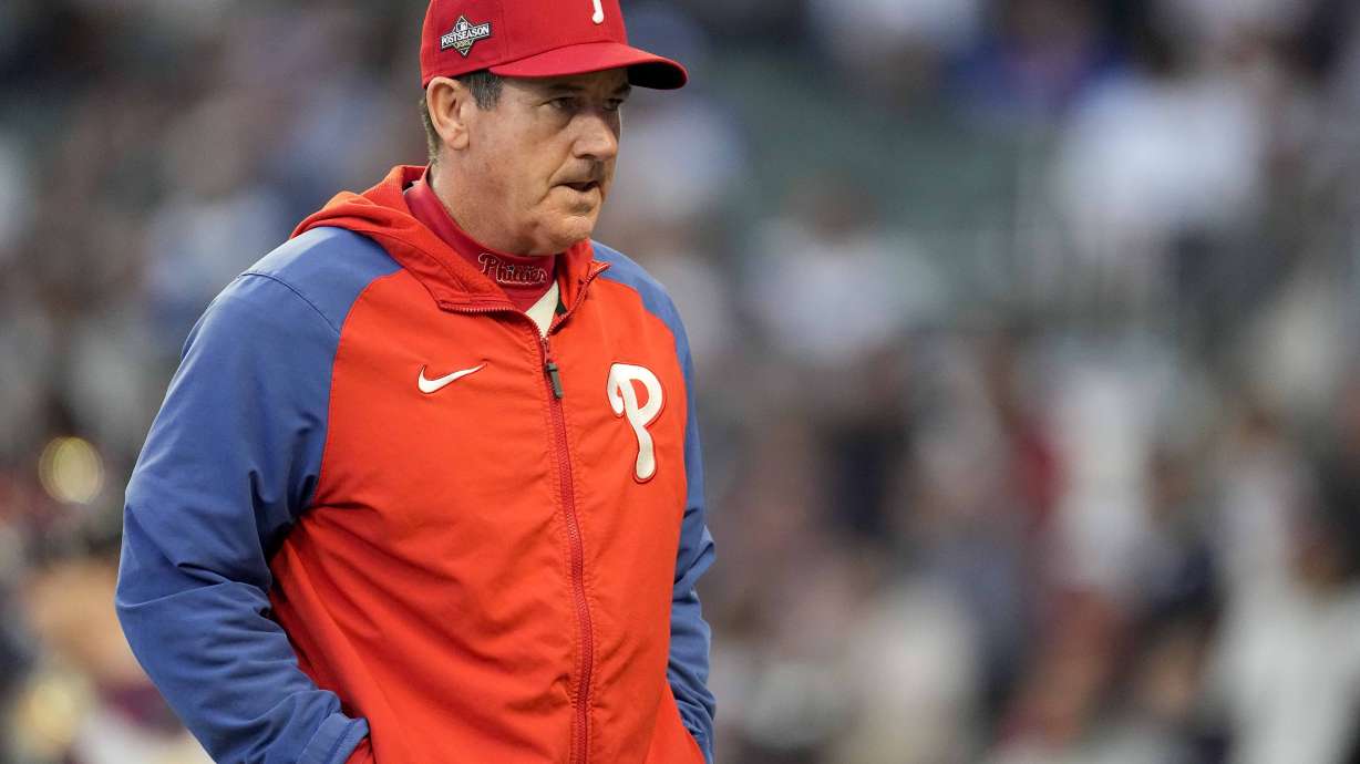 FILE - Philadelphia Phillies Manager Rob Thomson walks to the mound during the fourth inning of Game 1 of a baseball NL Division Series against Atlanta Braves, Oct. 7, 2023, in Atlanta. The Phillies announced Monday, Dec. 4, 2023, that they have extended Thomson's contract through the 2025 season after he led the team to two straight trips to the NL Championship Series.