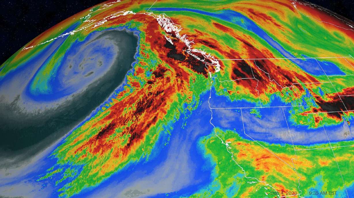 This water vapor satellite image shows an atmospheric river pushing into southwestern Canada on Monday morning. Darker reds denote the greatest level of moisture in the air.
