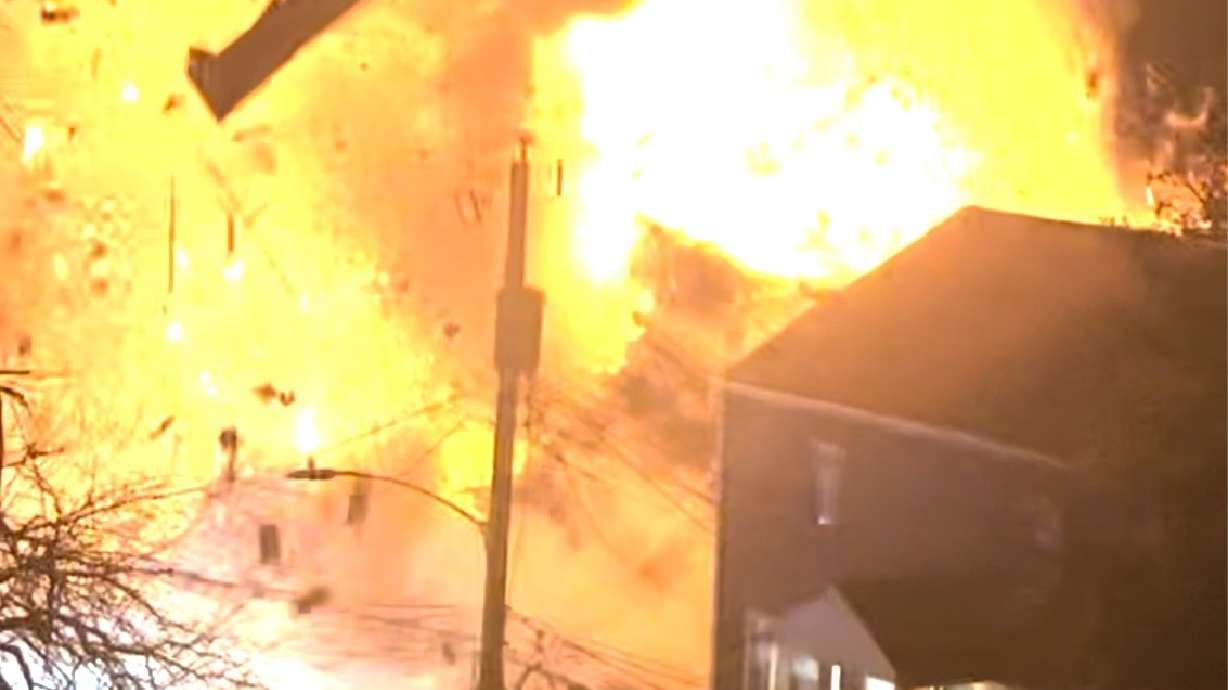 Virginia police say a house exploded as officers were trying to serve a search warrant on Monday in Arlington, Va.