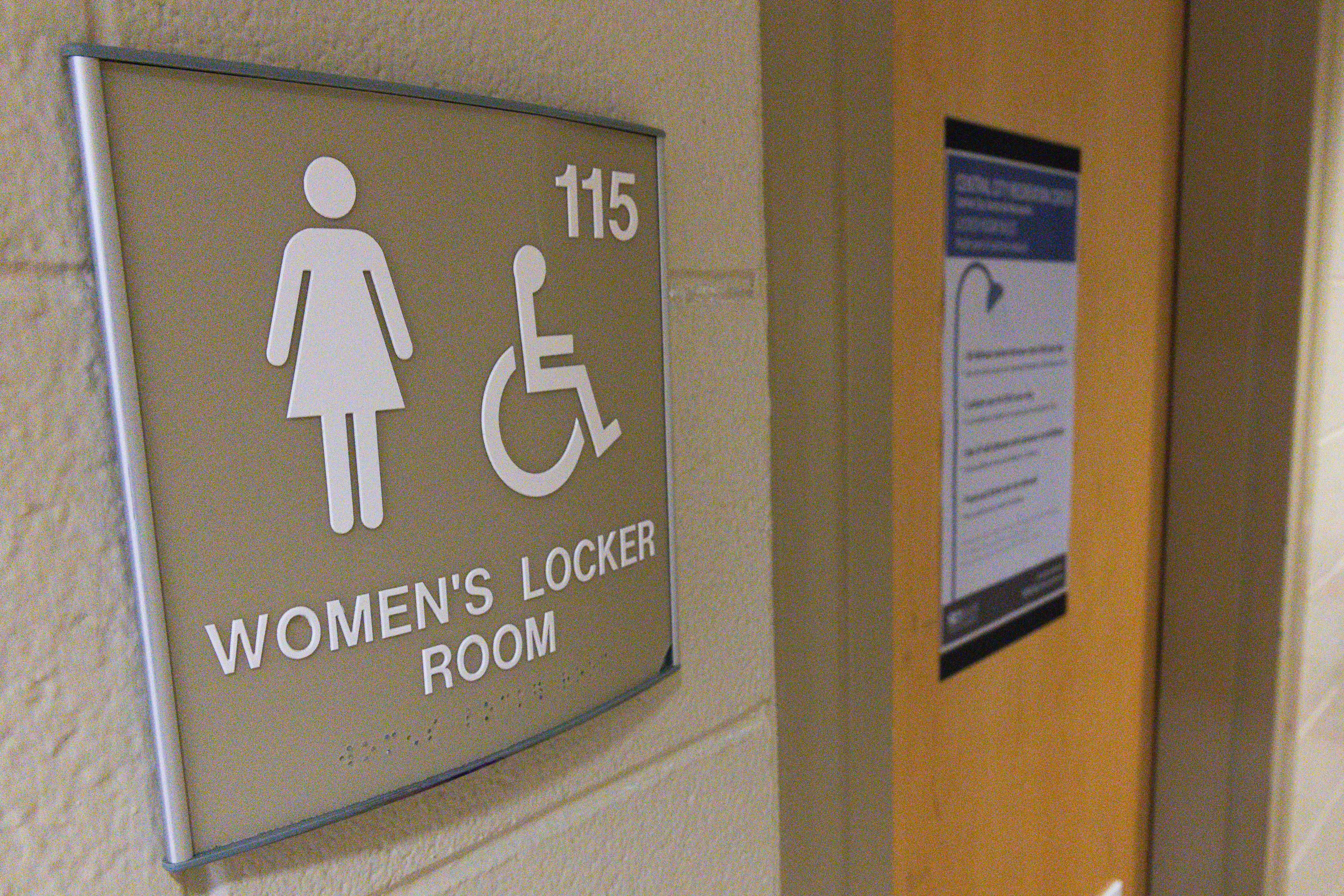 Signage on the locker rooms at Central City Recreation Center in Salt Lake City on Monday. Salt Lake County is examining a proposal about restrooms at county park and recreational facilities.
