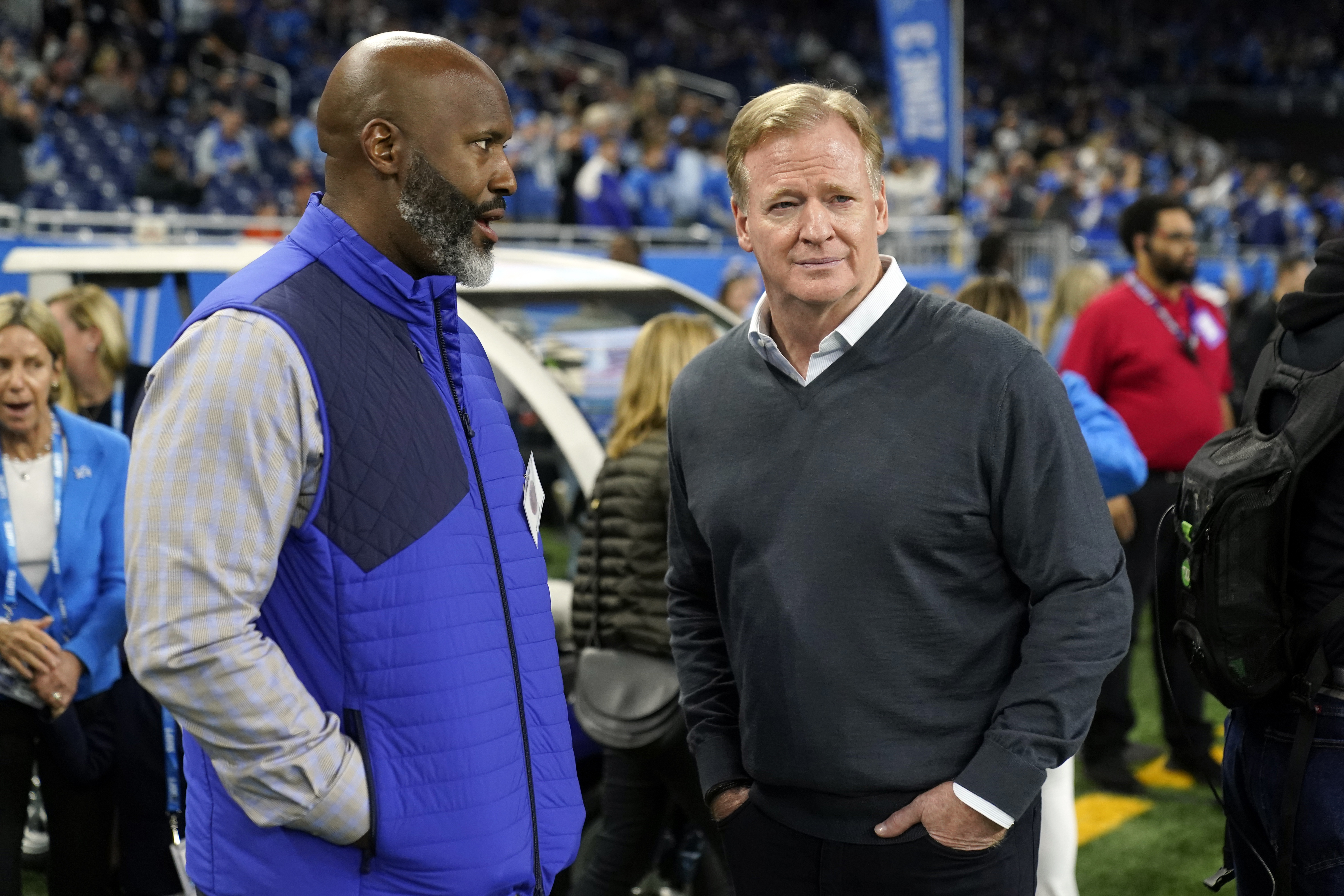 Detroit Lions general manager Brad Holmes, left, talks with NFL Commissioner Roger Goodell before the first half of an NFL football game, Sunday, Nov. 19, 2023, in Detroit.