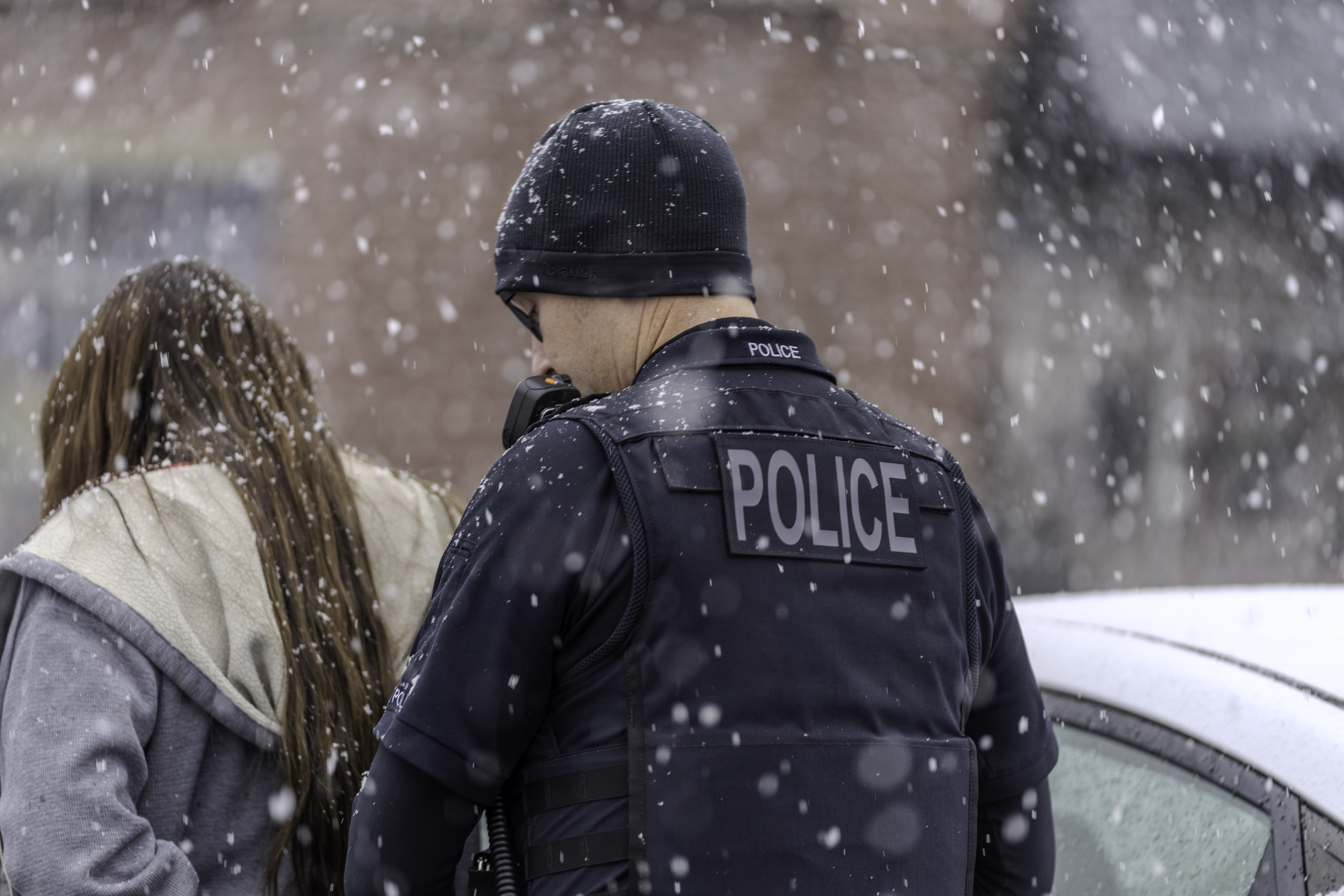 A Salt Lake City police officer arrests a person on Dec. 1 during a multi-day blitz led by the Utah Attorney General's Office aimed at combating holiday retail theft.