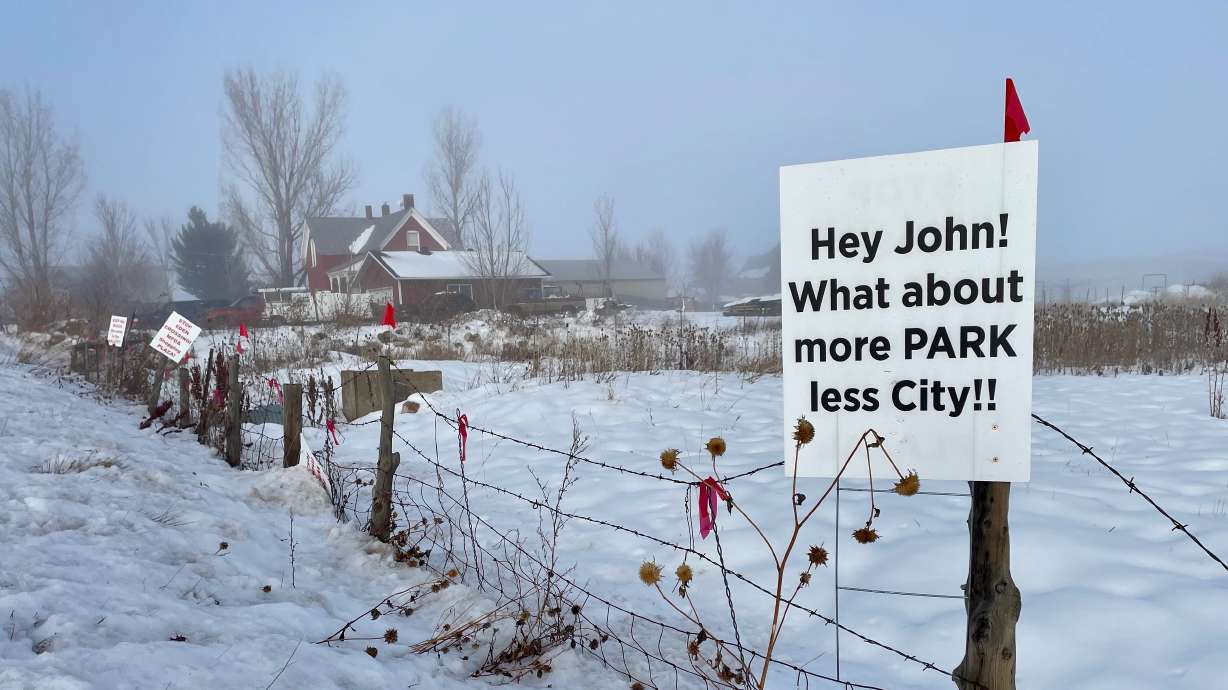 Signs protesting the proposed Eden Crossing development in the Ogden Valley sit along state Route 158 on Wednesday. Weber County commissioners granted preliminary approval to a rezone request for the project to move forward.