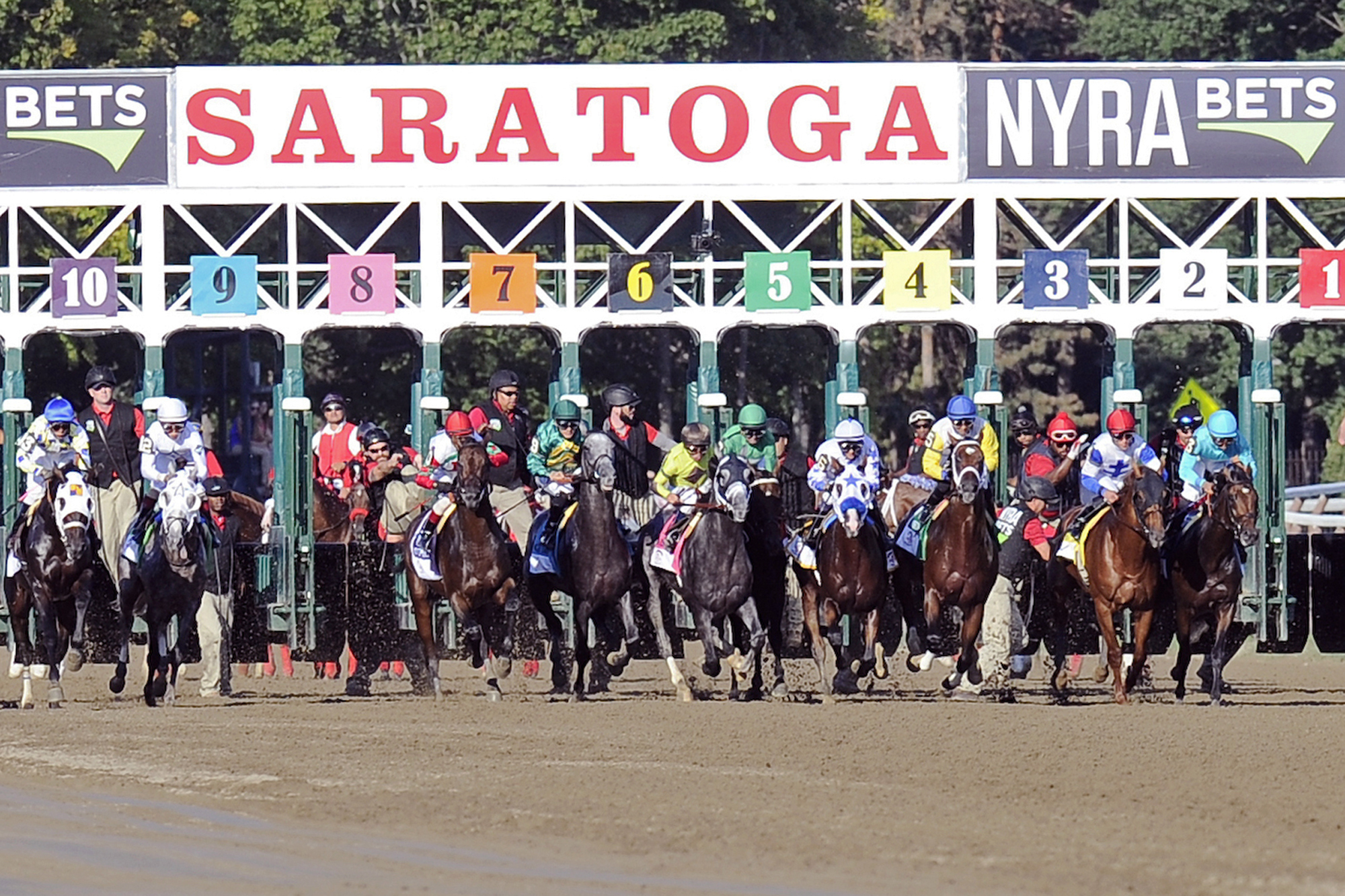 FILE - Horses break from the gate at the start of the Travers Stakes horse race at Saratoga Race Course in Saratoga Springs, Aug. 27, 2016. The 2024 Belmont Stakes will be run at Saratoga Race Course, with the third leg of horse racing's Triple Crown shifting from Long Island to upstate to New York because of the massive renovation of Belmont Park. New York Gov. Kathy Hochul announced the move Wednesday, Dec. 6, 2023, which has been expected for some time since the New York Racing Association unveiled plans for the $455 million Belmont Park project.