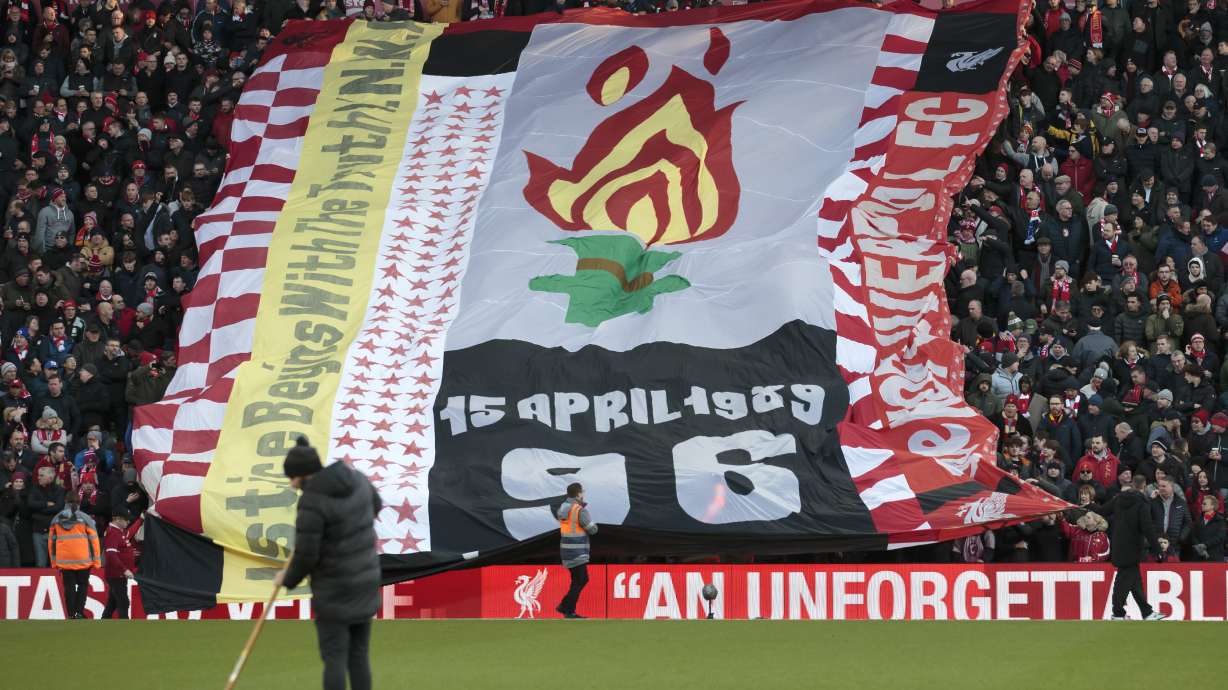 FILE - Fans hold up a tribute to the victims of the Hillsborough disaster before the English Premier League soccer match between Liverpool and Brighton at Anfield Stadium, Liverpool, England, Saturday, Nov. 30, 2019. The British government apologized Wednesday, Dec. 6, 2023 to the families of 97 Liverpool soccer fans who died after a stadium crush 34 years ago, as it introduced a charter it said will sharply diminish the chances that others will endure the kinds of injustices they suffered.