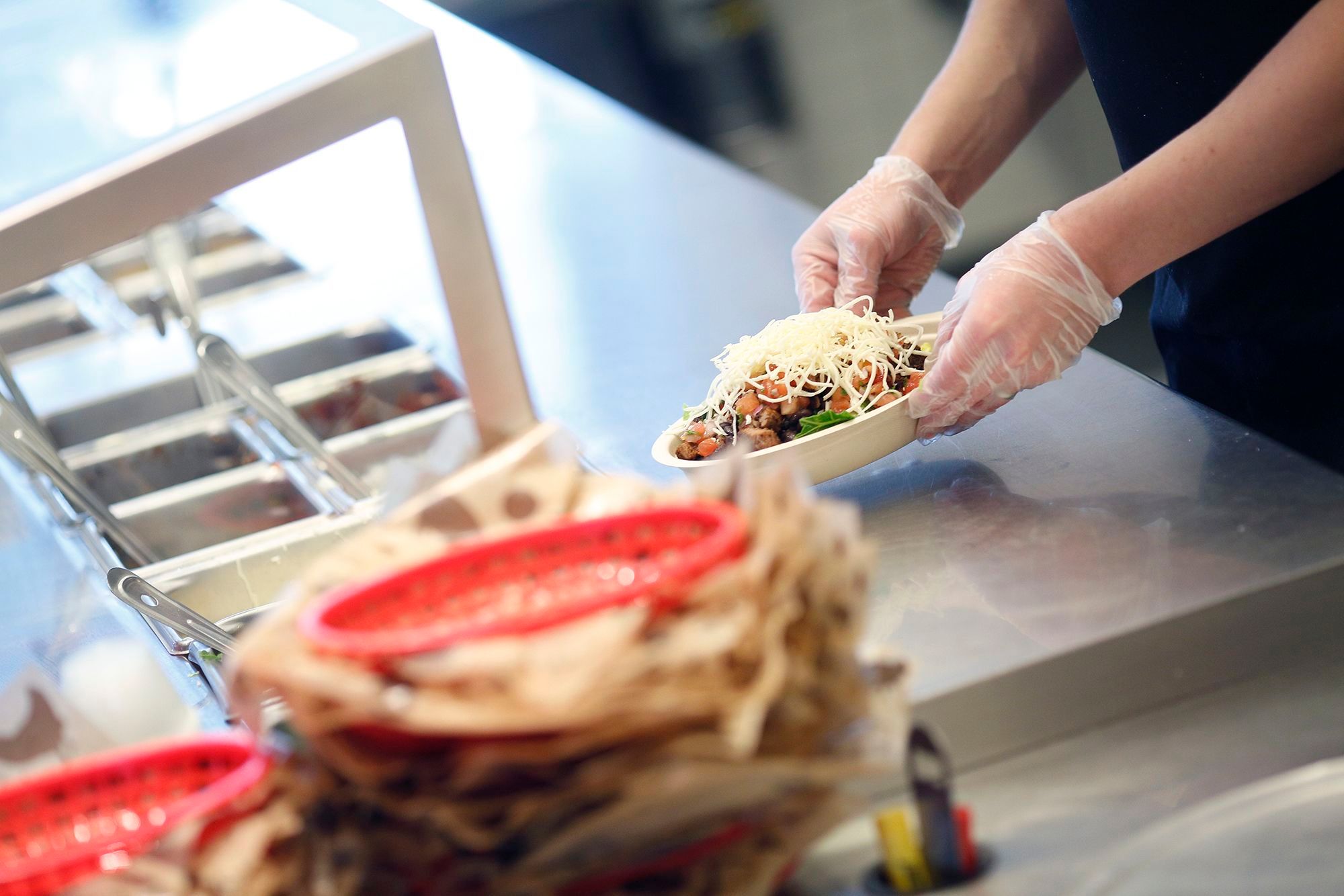 A customer who threw a burrito bowl in a Chipotle worker's face in September has been sentenced to work in the fast food industry for two months.