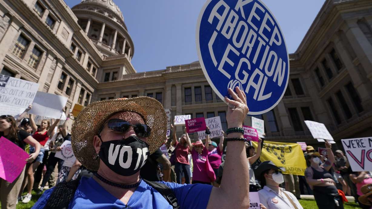 Abortion rights demonstrators attend a rally at the Texas state Capitol in Austin, Texas, May 14, 2022. A Texas judge has given a pregnant woman permission to get an abortion in an unprecedented challenge to the state's ban.