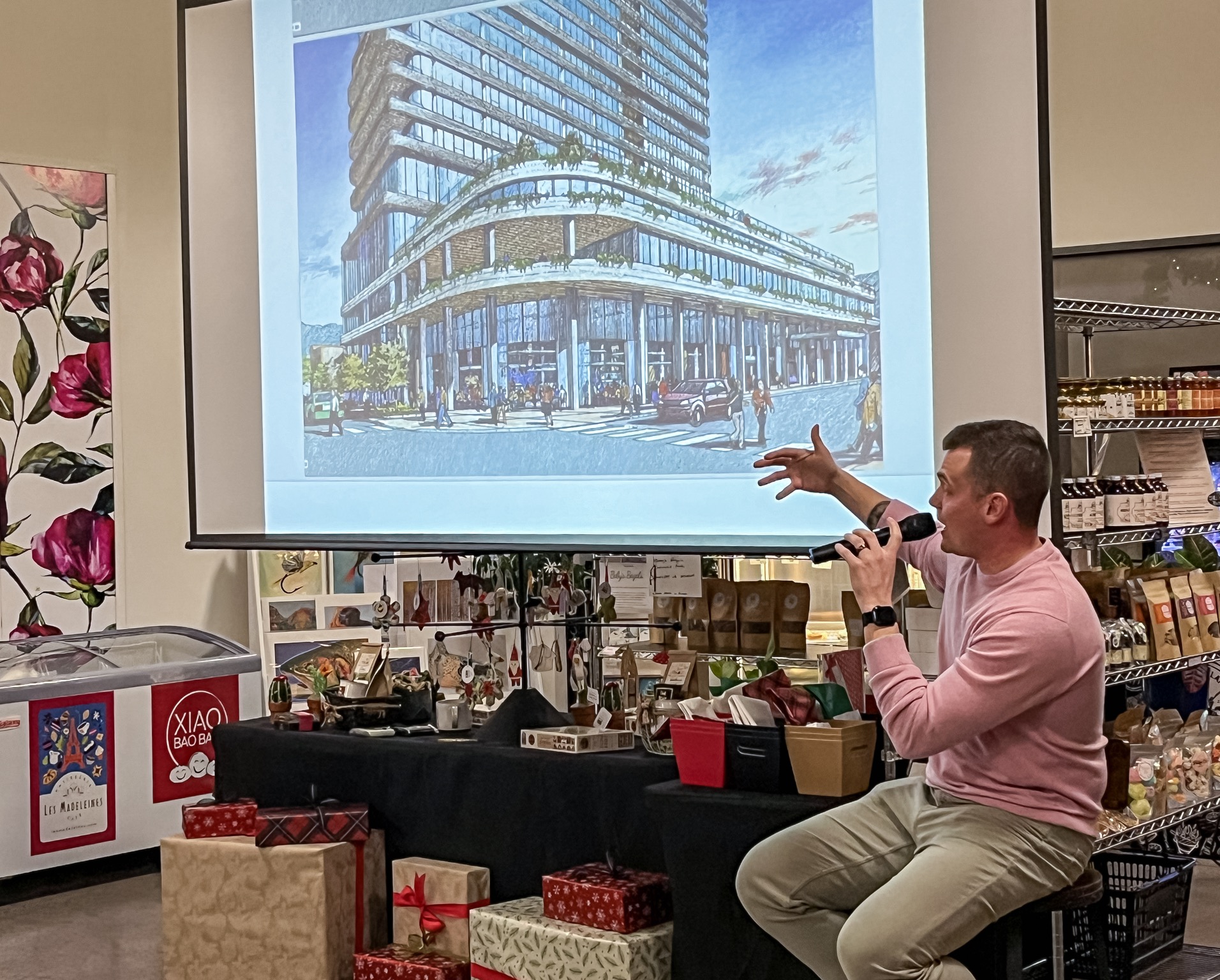 Dan Whalen, vice president of design and development for Harbor Bay Ventures, shows a rendering of a possible new building in Sugar House during a Sugar House Community Council meeting at the Neighborhood Hive in Salt Lake City on Wednesday.
