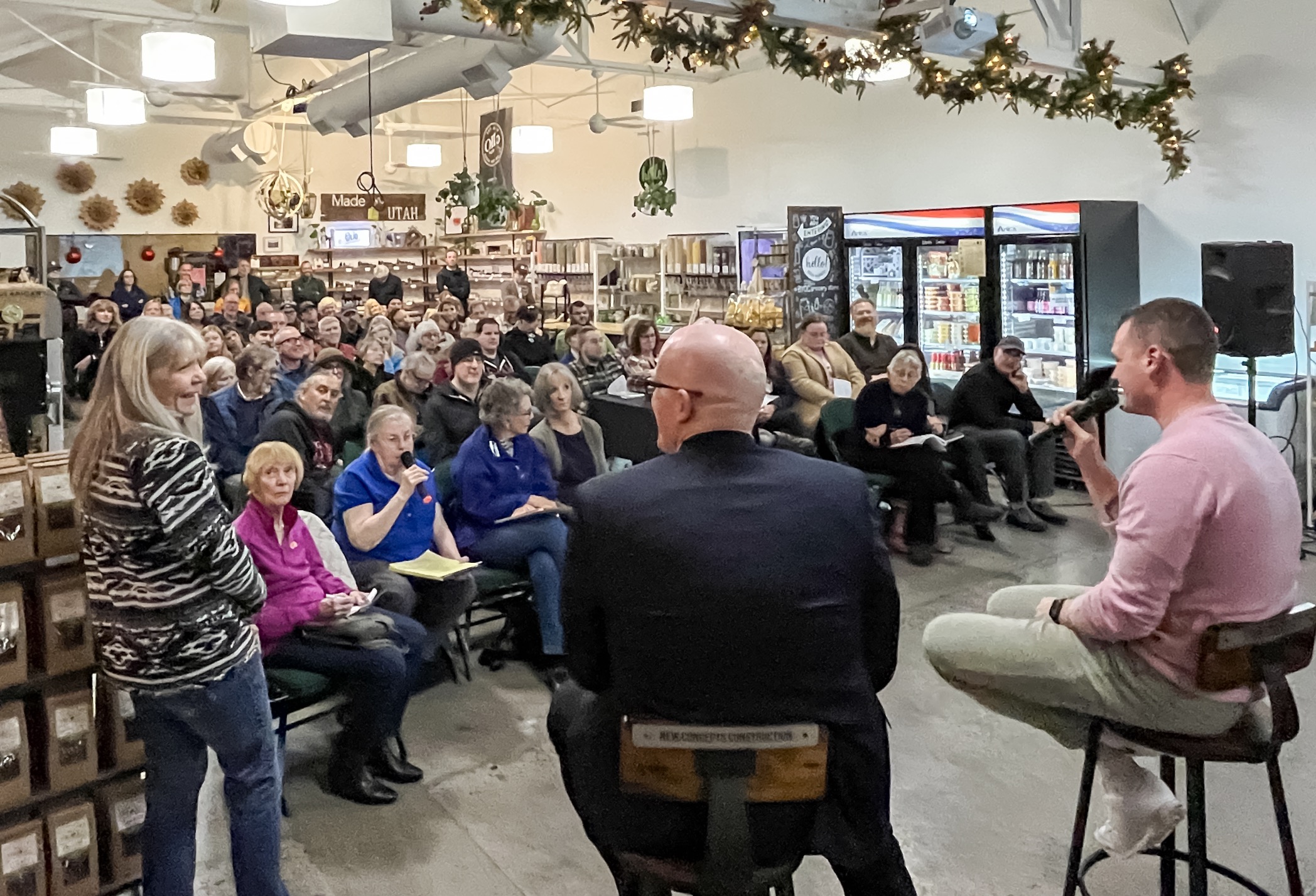 Sugar House residents pack The Neighborhood Hive to listen to a presentation by Harbor Bay Ventures officials about their rezone proposal in Sugar House during a Sugar House Community Council meeting Wednesday night.