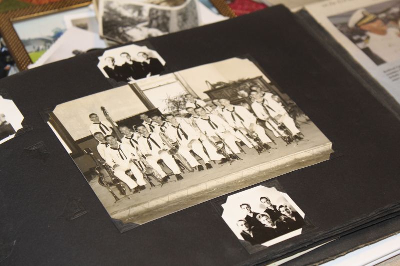 A photo album in the home of Pearl Harbor survivor Ira "Ike" Schab in Beaverton, Ore. on Nov. 20, shows an old group photo of the U.S. Navy Band. Schab, now 103, played tuba in the band and remained close with his bandmates for decades after the war.