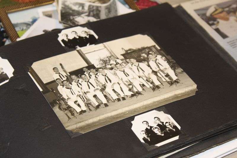 A photo album in the home of Pearl Harbor survivor Ira "Ike" Schab in Beaverton, Ore. on Nov. 20, shows an old group photo of the U.S. Navy Band. Schab, now 103, played tuba in the band and remained close with his bandmates for decades after the war.